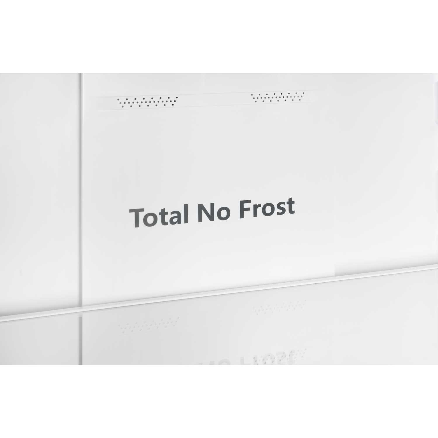 White interior of a refrigerator with 'Total No Frost' text.