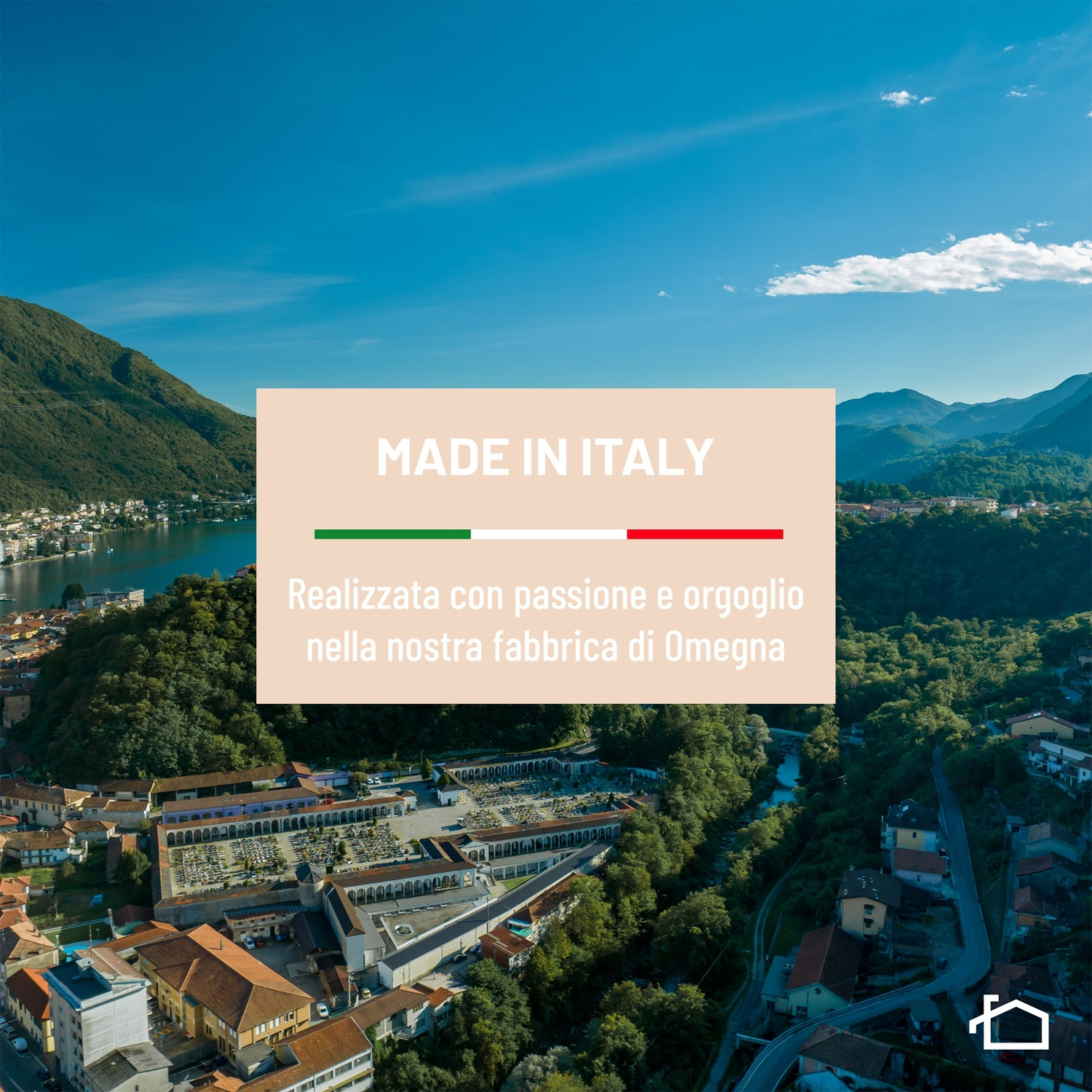 Vista aerea di una città sul lago con montagne sullo sfondo e testo.
