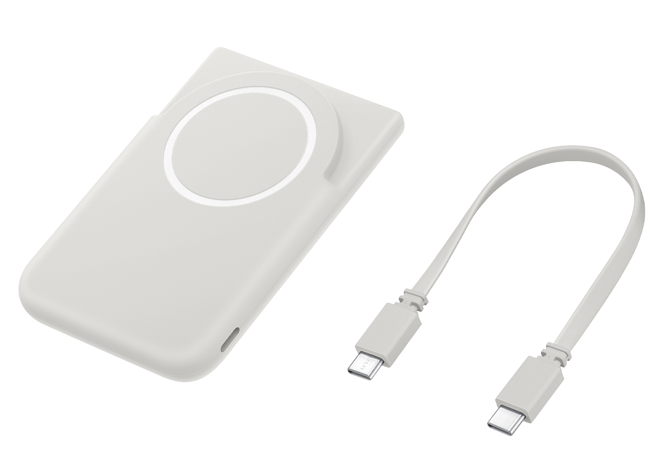 Un cargador inalámbrico blanco y un cable USB-C blanco yacen uno al lado del otro.