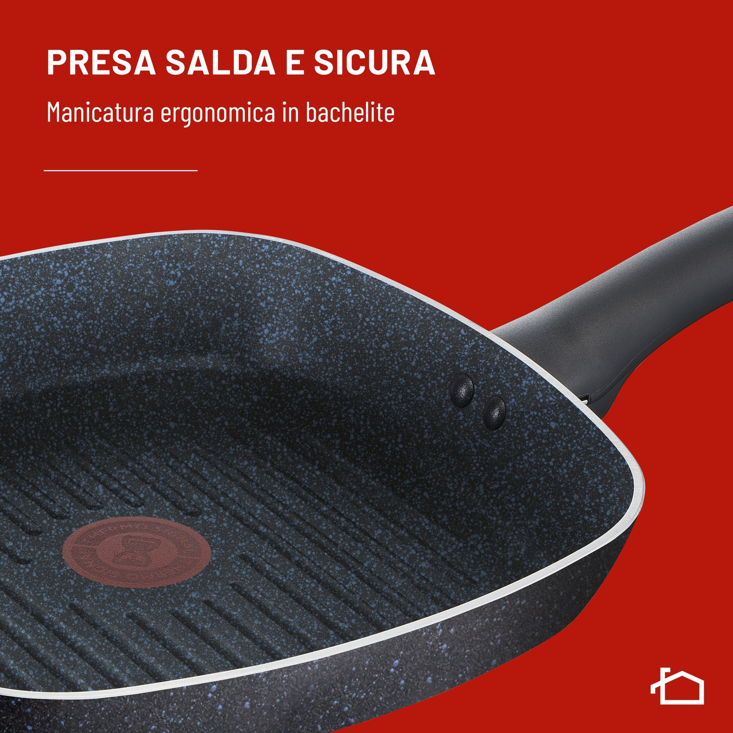 Primo piano di una padella grill nera con un termospot rosso.