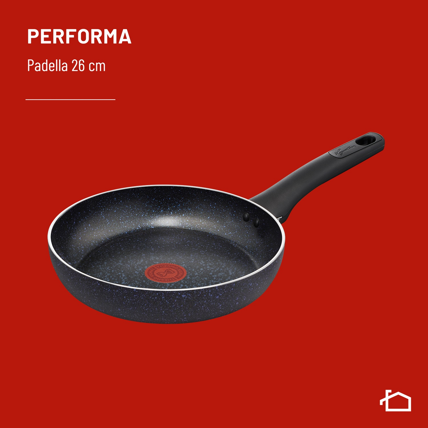 Una padella nera effetto granito con Thermospot rosso su sfondo rosso.