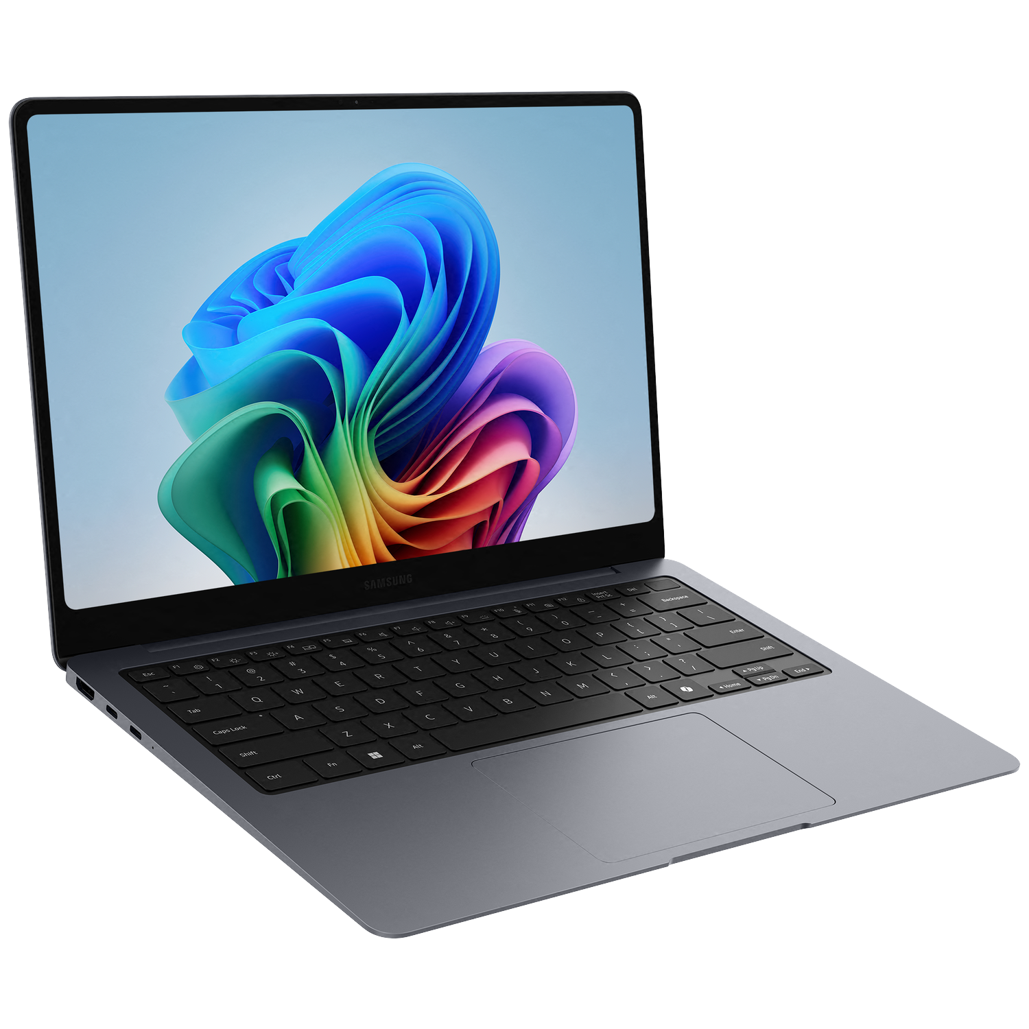 A modern, dark gray Samsung laptop is open, displaying a colorful abstract wallpaper on its screen.