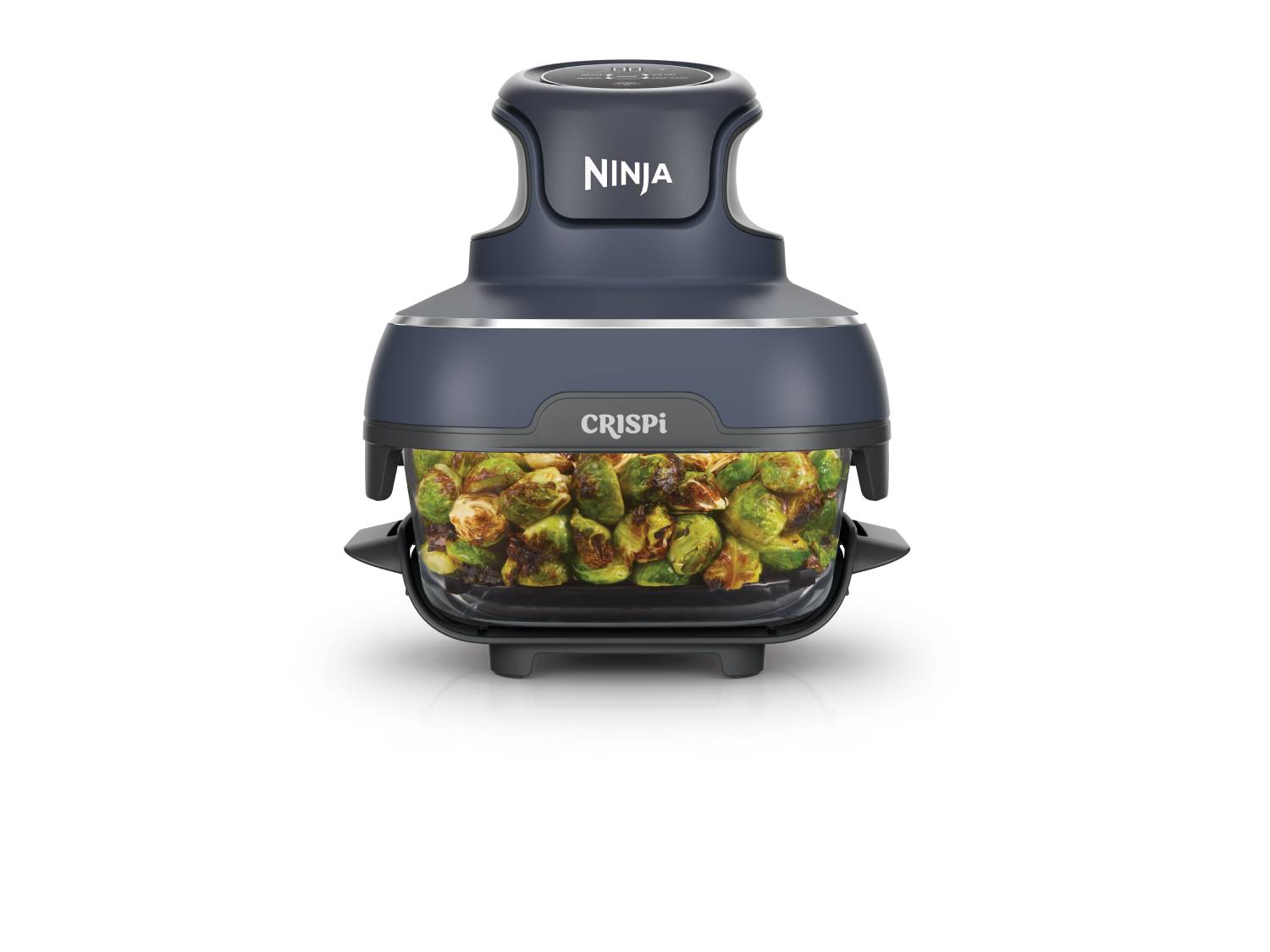 Freidora de aire Ninja Crispi gris oscuro con coles de Bruselas asadas en recipiente de vidrio.