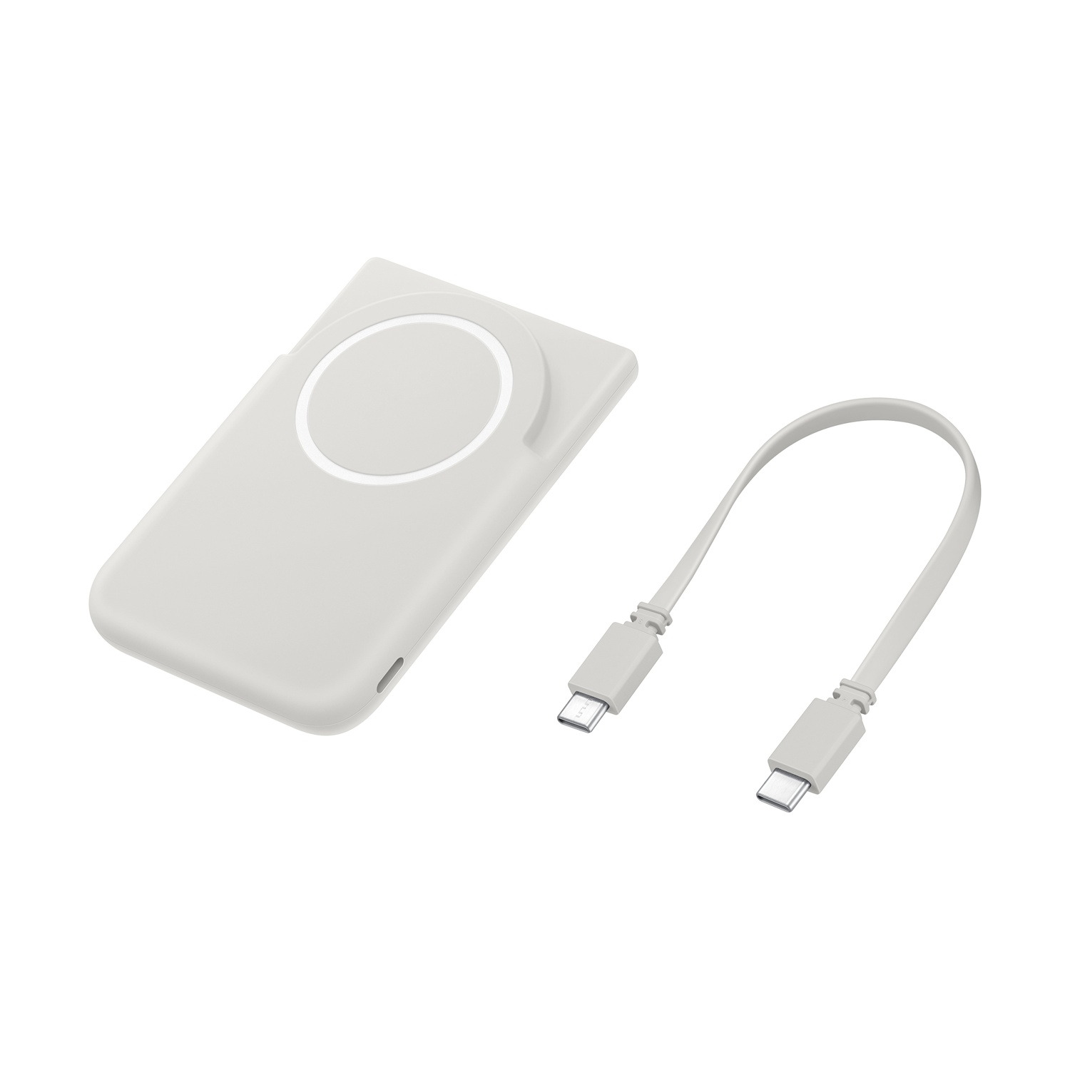 Un caricabatterie MagSafe bianco con un cavo USB-C piegato accanto.