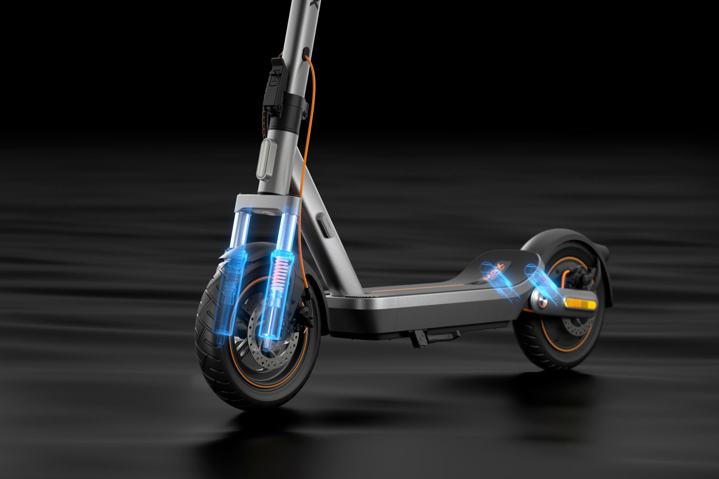 Ein E-Scooter mit beleuchteter Federung und orangen Akzenten auf dunklem Grund.
