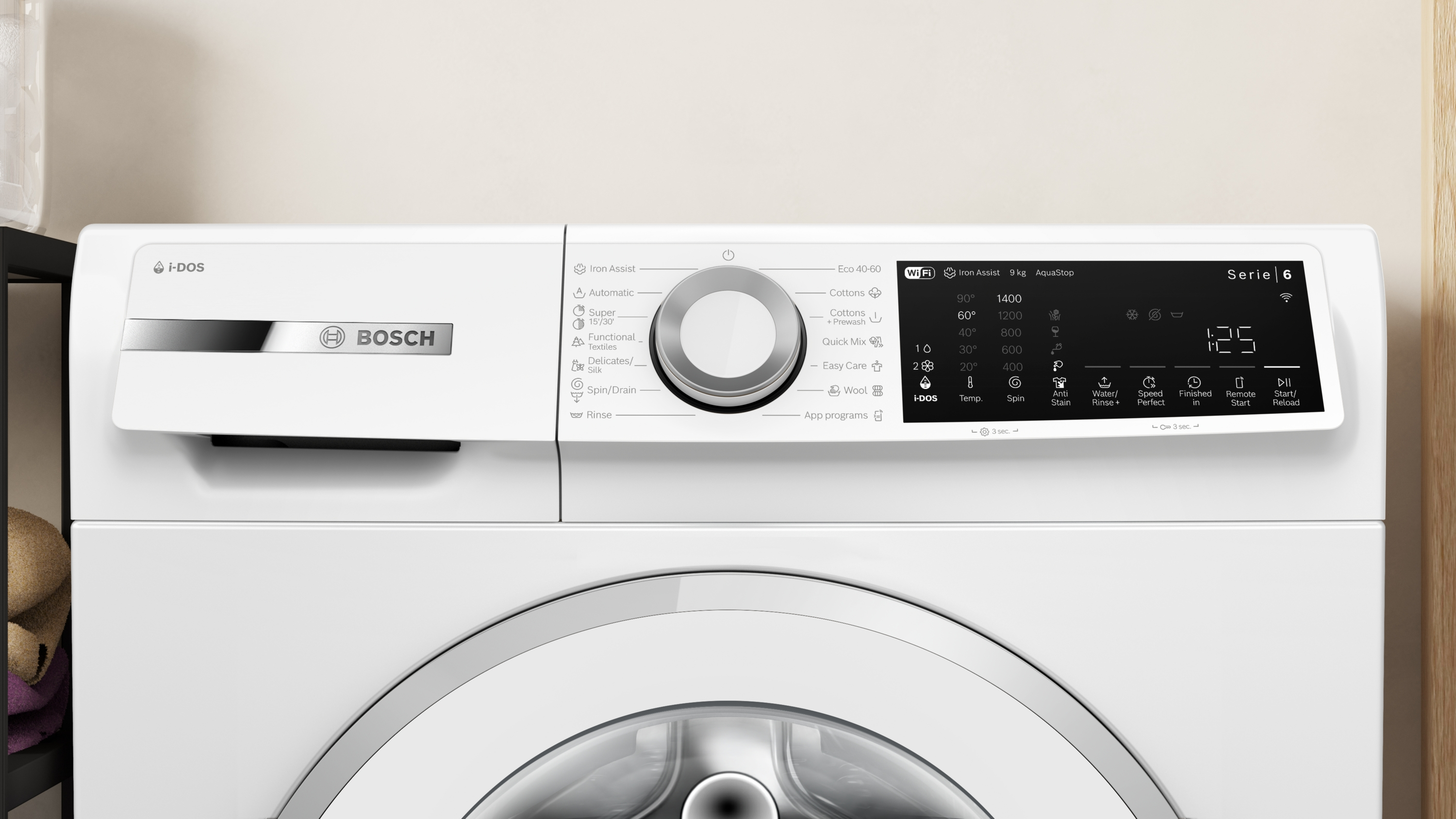 Bosch mosógép i-DOS rendszerrel és digitális kijelzővel. Programválasztási opciók láthatók.