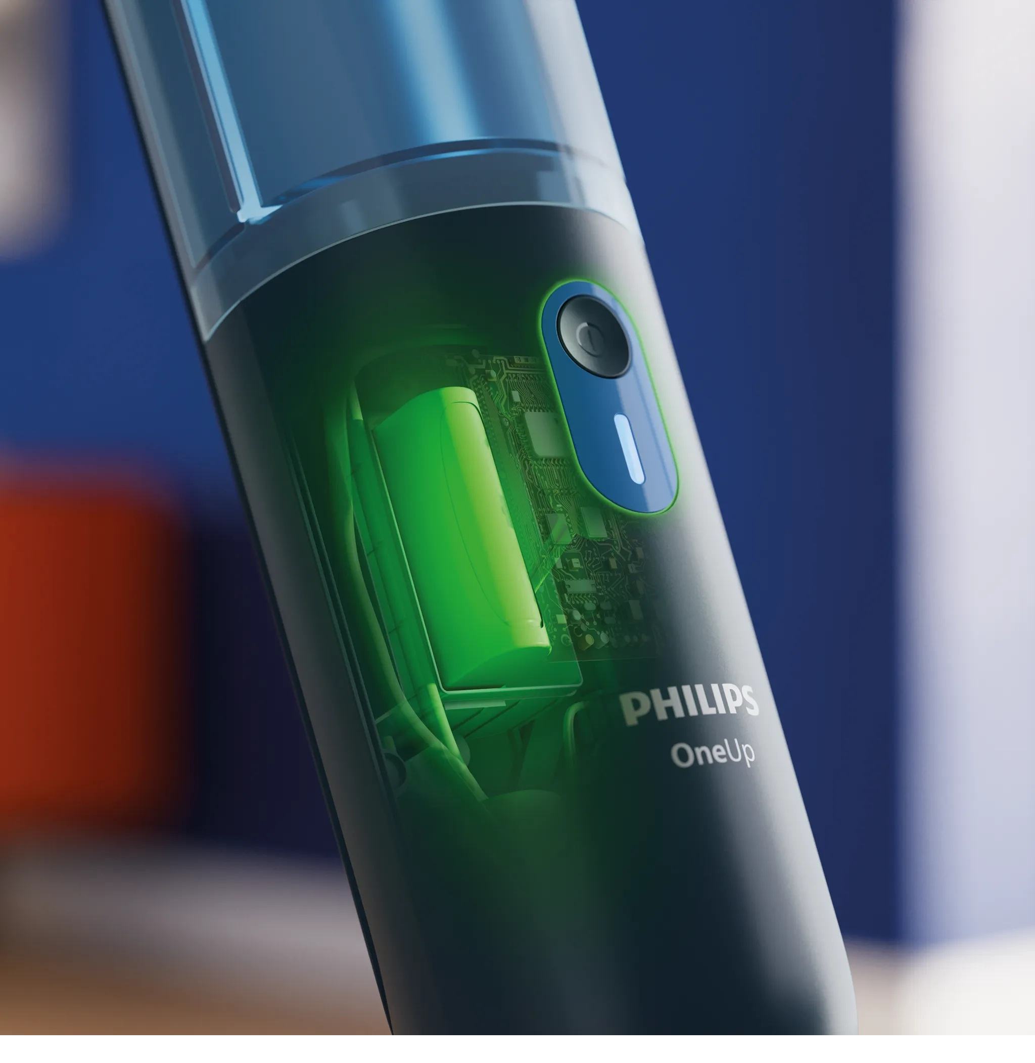 Zbliżenie urządzenia Philips OneUp z przezroczystą obudową pokazującą zieloną baterię.