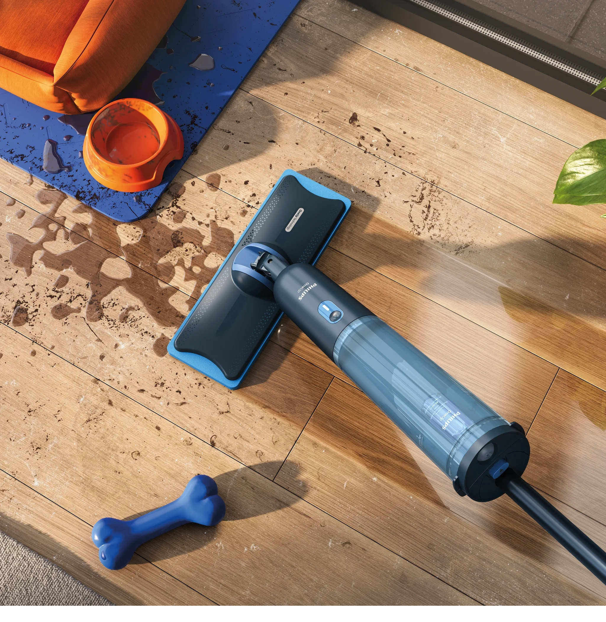 Niebieski mop leży na drewnianej podłodze obok pomarańczowego legowiska i miski dla psa.