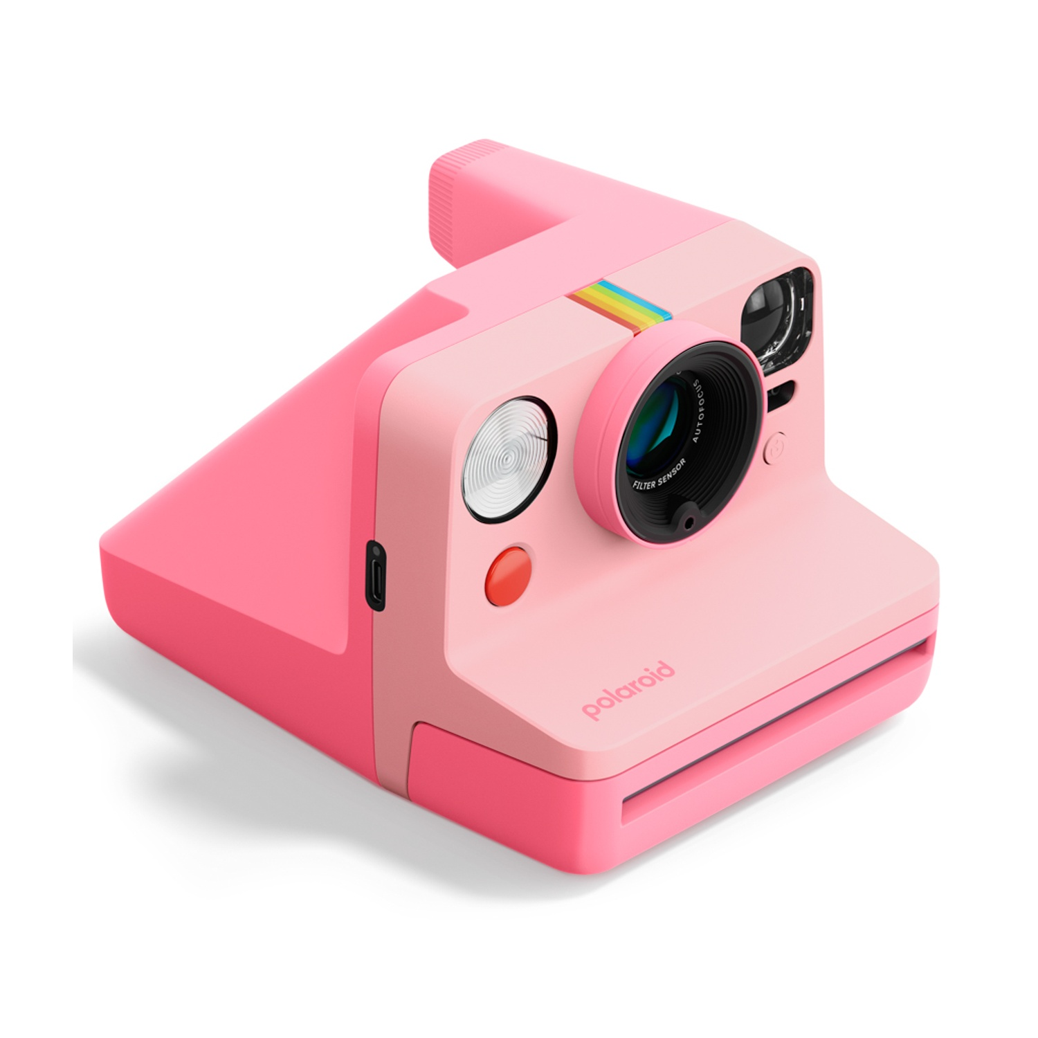 Una fotocamera istantanea Polaroid rosa con dettaglio arcobaleno sull'obiettivo.