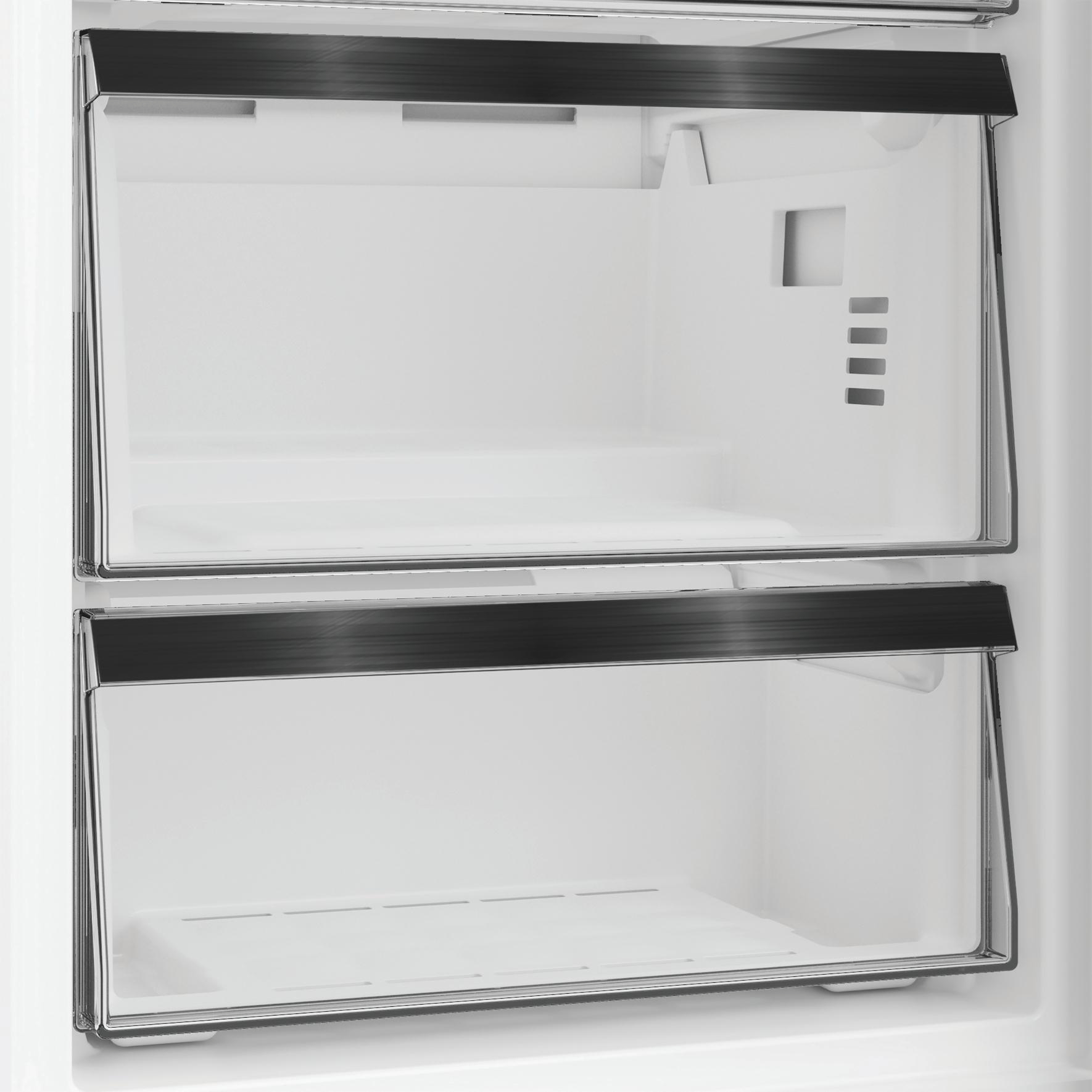 Zwei leere, durchsichtige Schubladen mit schwarzen Griffen in einem Kühlschrank.