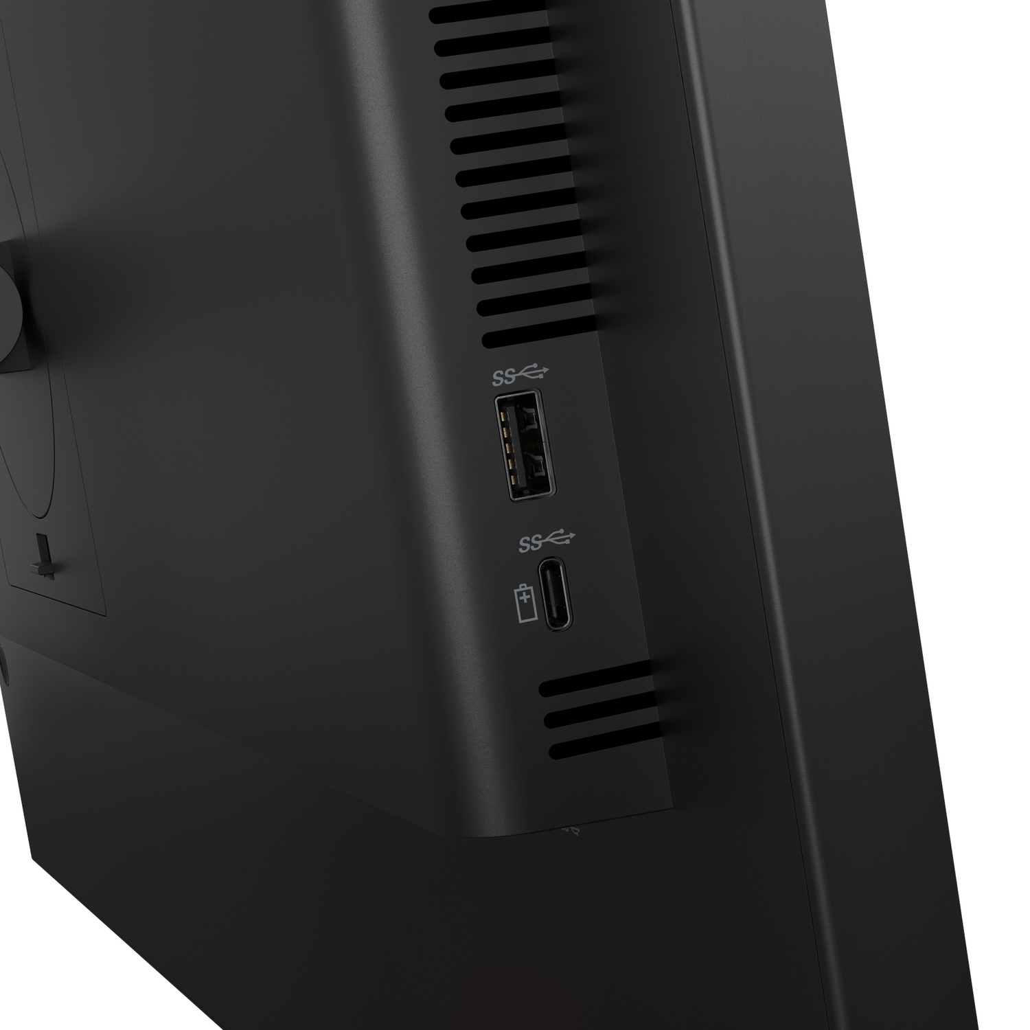Close-up van een zwart apparaat met USB-poorten en ventilatiesleuven.