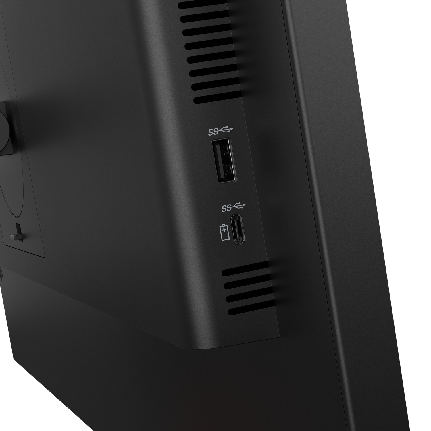 Gros plan d'un ordinateur noir avec ports USB et fentes de ventilation.