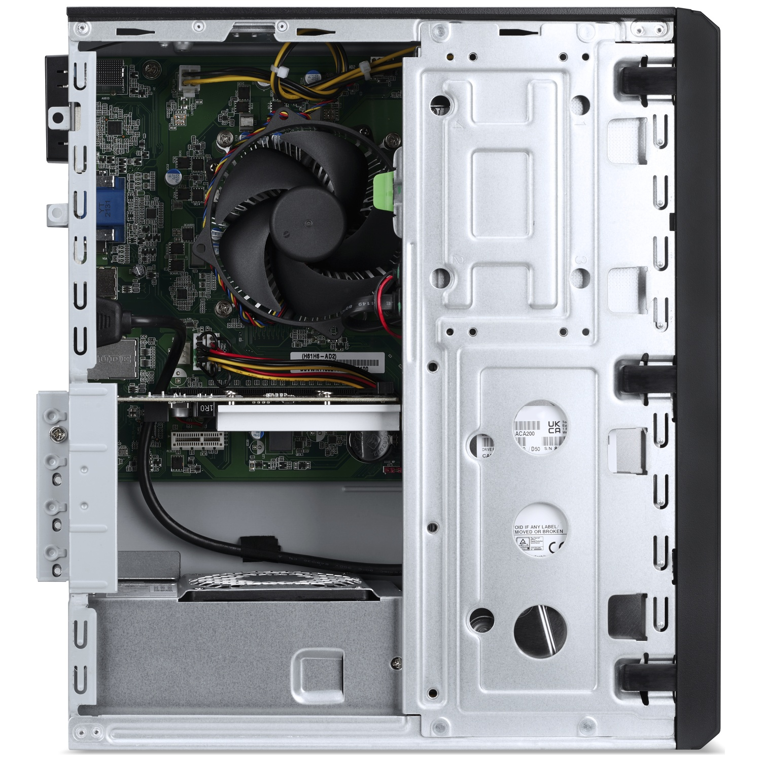 An open computer tower shows the motherboard, fan, cables, and metal casing.