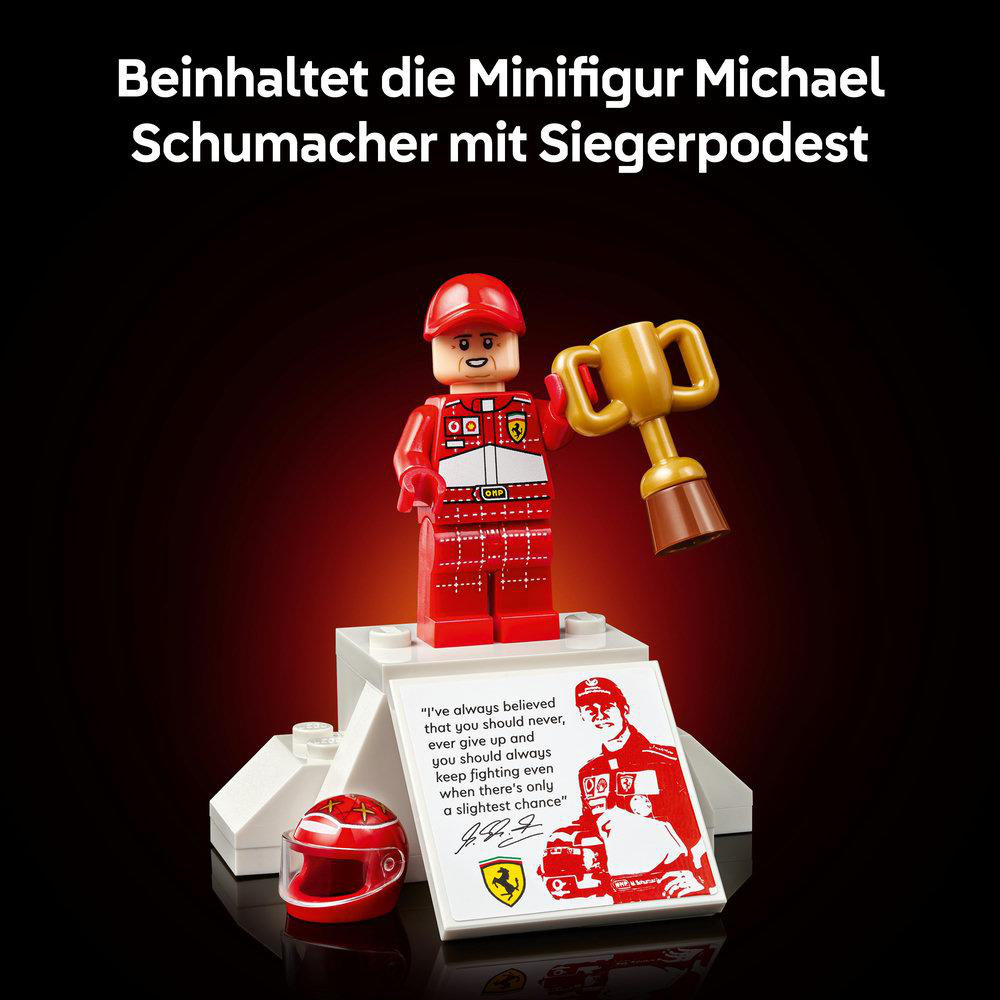 Lego-Figur Michael Schumacher im roten Rennanzug mit Trophäe und Helm.