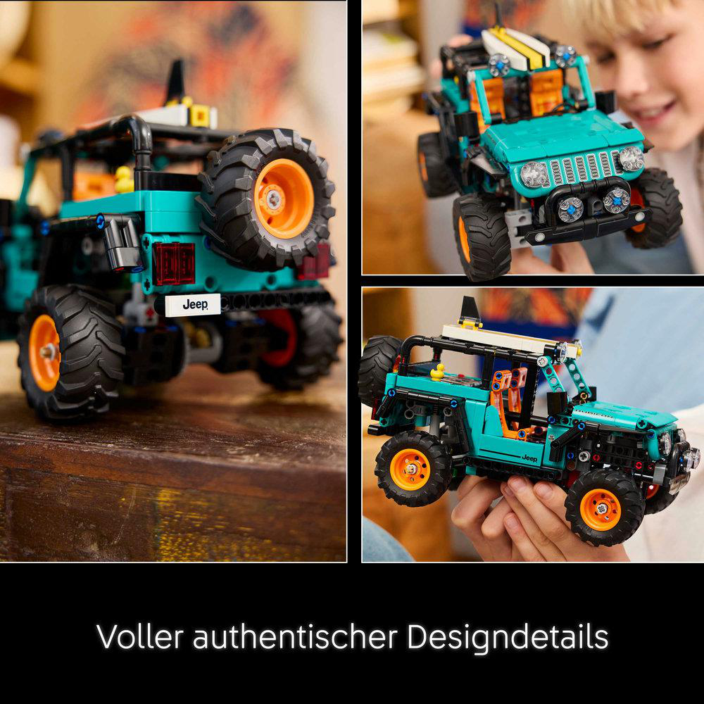 Ein türkisfarbener Jeep mit großen Rädern und orangen Felgen.