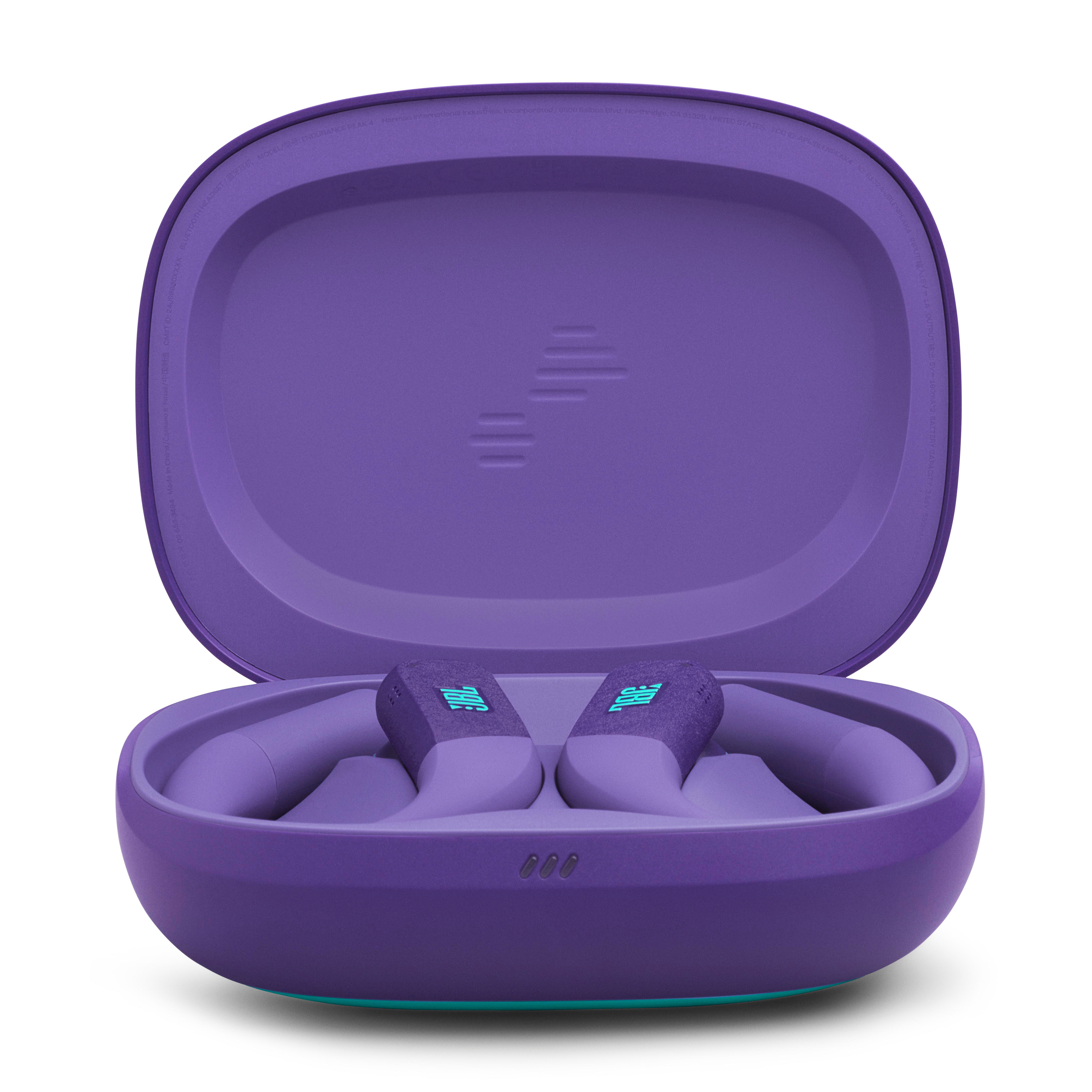 Lila Kopfhörer mit Ladecase, JBL-Logo leuchtet blau.