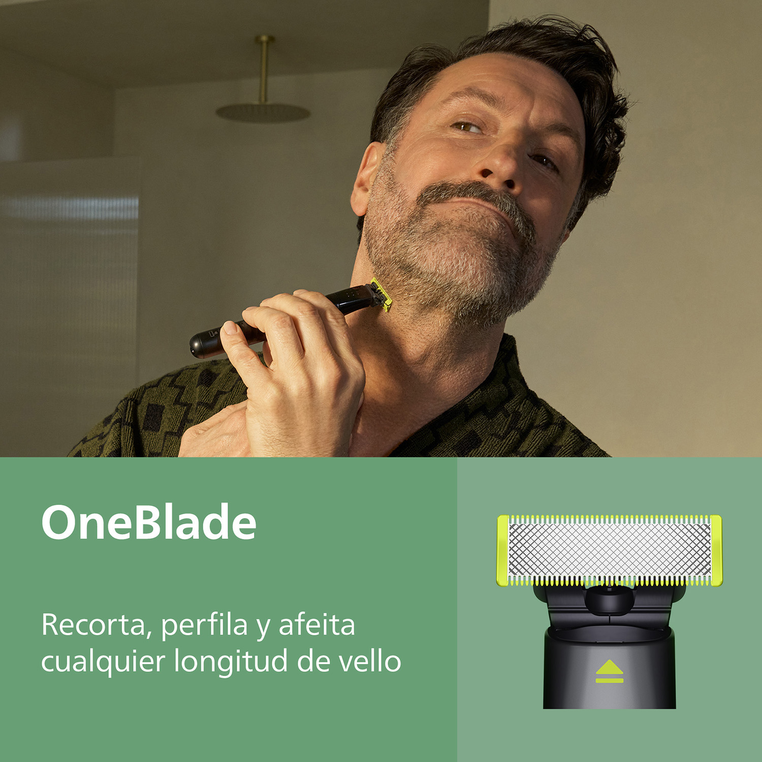 Hombre arreglándose en baño con afeitadora eléctrica. Primer plano.