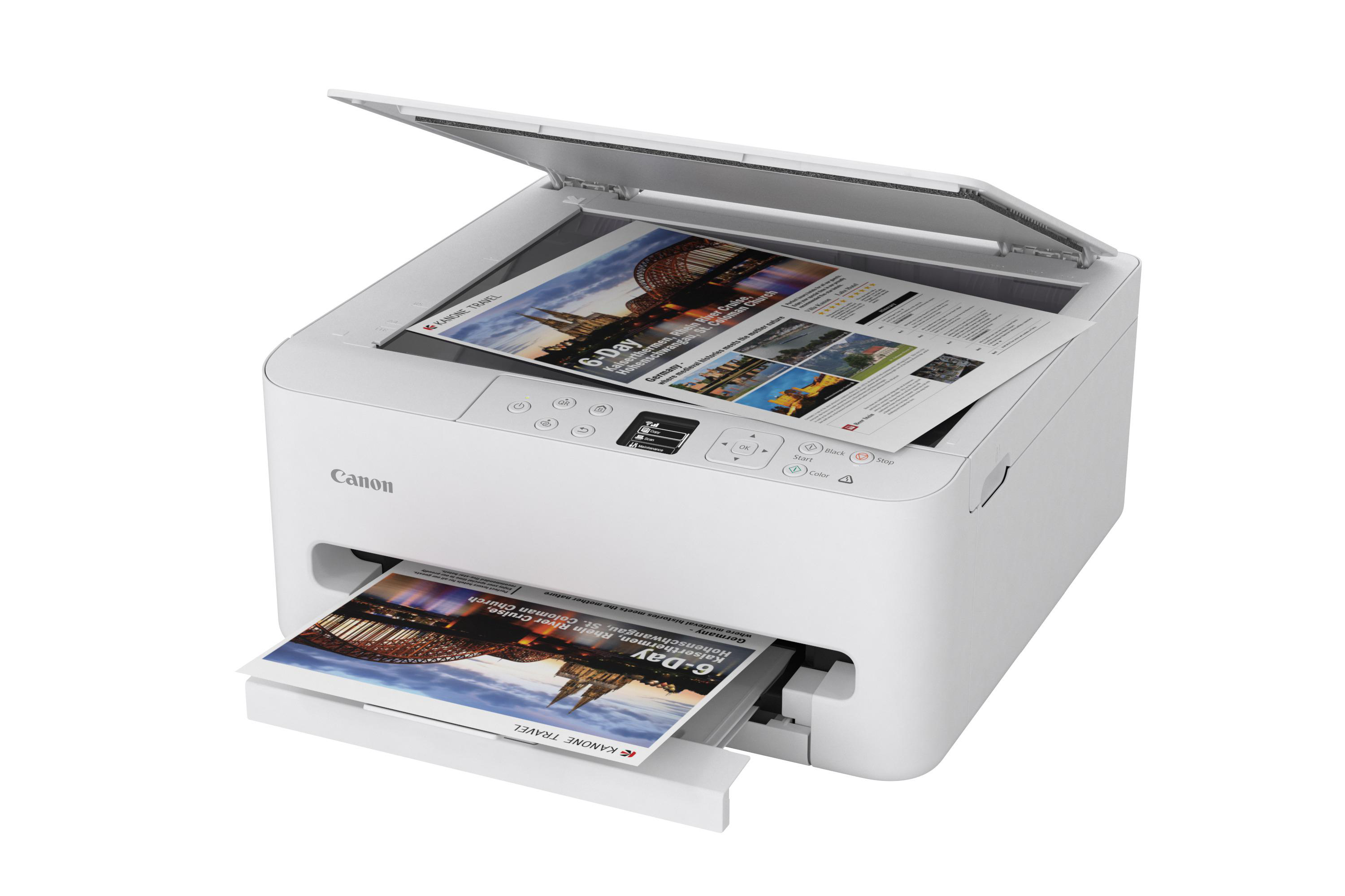 Ein weißer Canon Drucker mit geöffnetem Deckel und bedrucktem Papier.