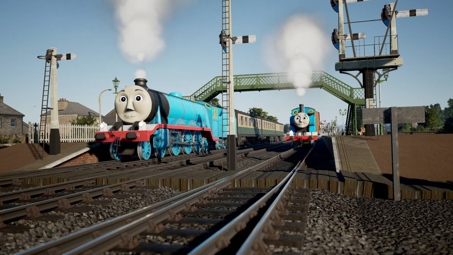 Dos trenes de dibujos animados, Gordon y Thomas, en vías con vapor. Edificios y señales cerca.