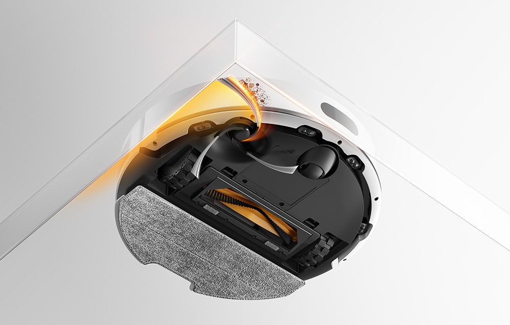 Odkurzacz automatyczny czyści róg, zasysa kurz.