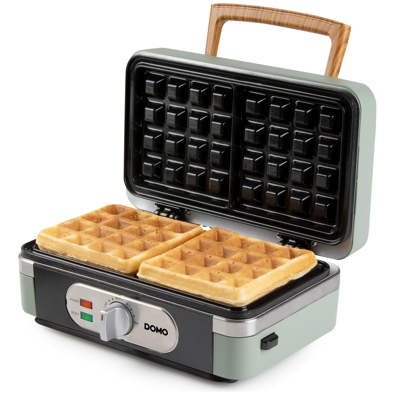 An open waffle maker with two cooked waffles, green casing, and a wooden handle.