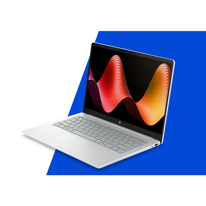 Ein offener Laptop mit silberner Tastatur und bunter Wellen-Hintergrundgrafik auf dem Bildschirm.