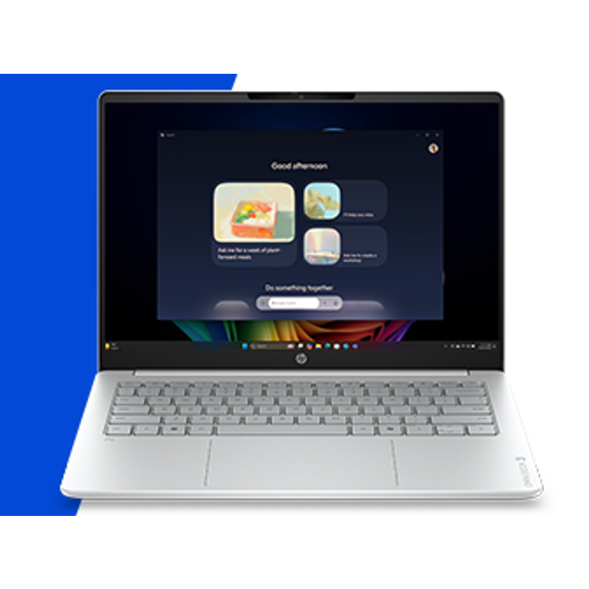 Ein silberner Laptop zeigt einen Bildschirm mit einer "Guten Nachmittag"-Meldung und bunten Grafiken.