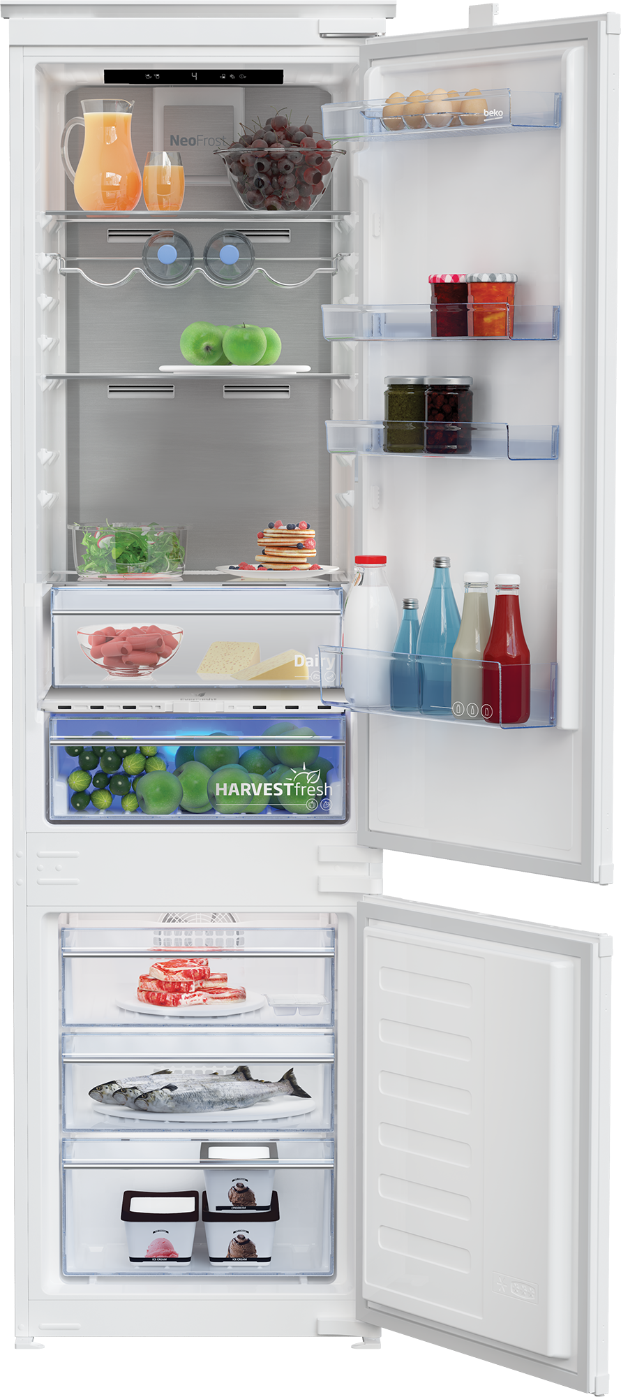 Otwarta lodówka z jedzeniem: sok, owoce, jajka, dżem, warzywa, mięso, ryby, lody.