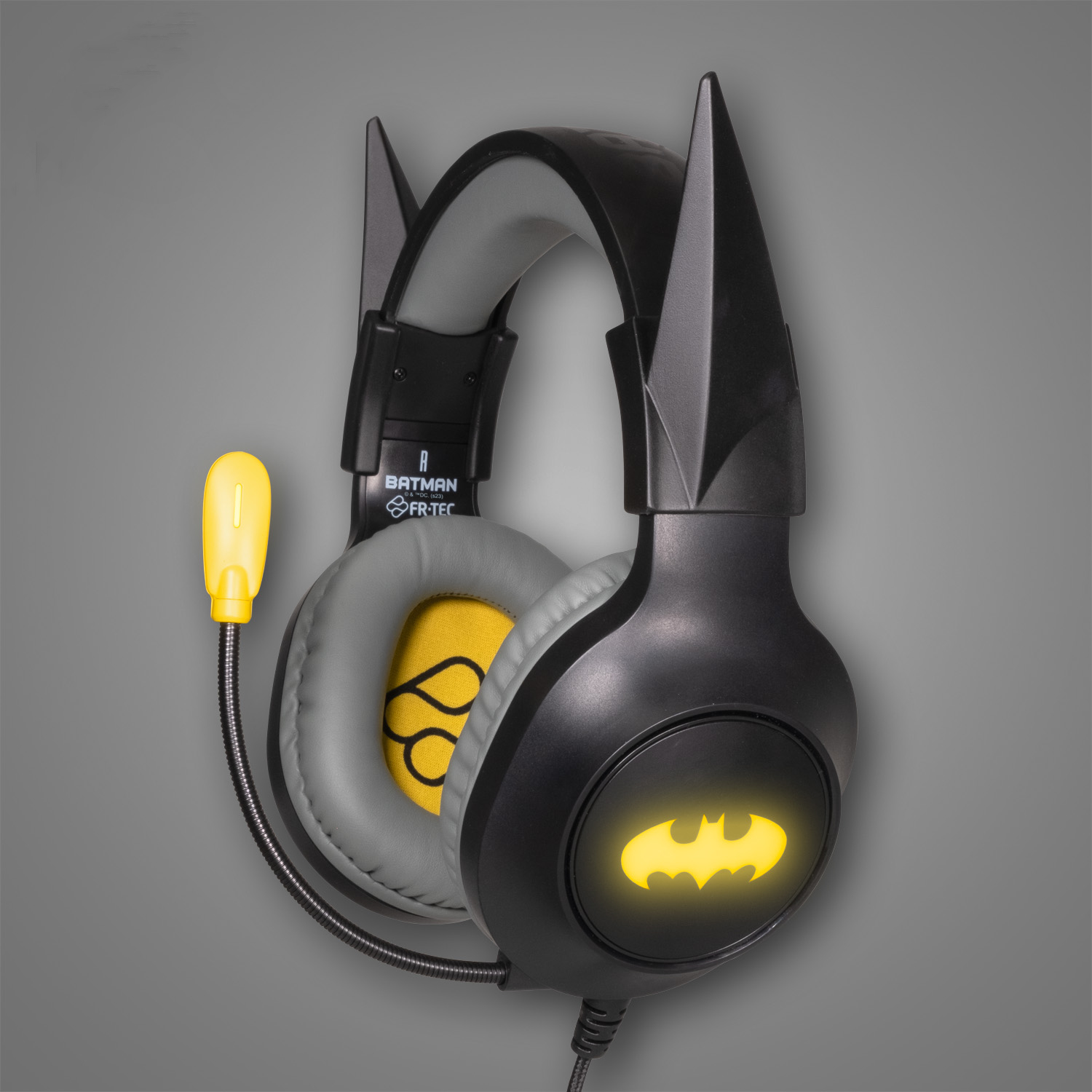 Schwarze Batman-Kopfhörer mit gelbem Logo und Mikrofon.