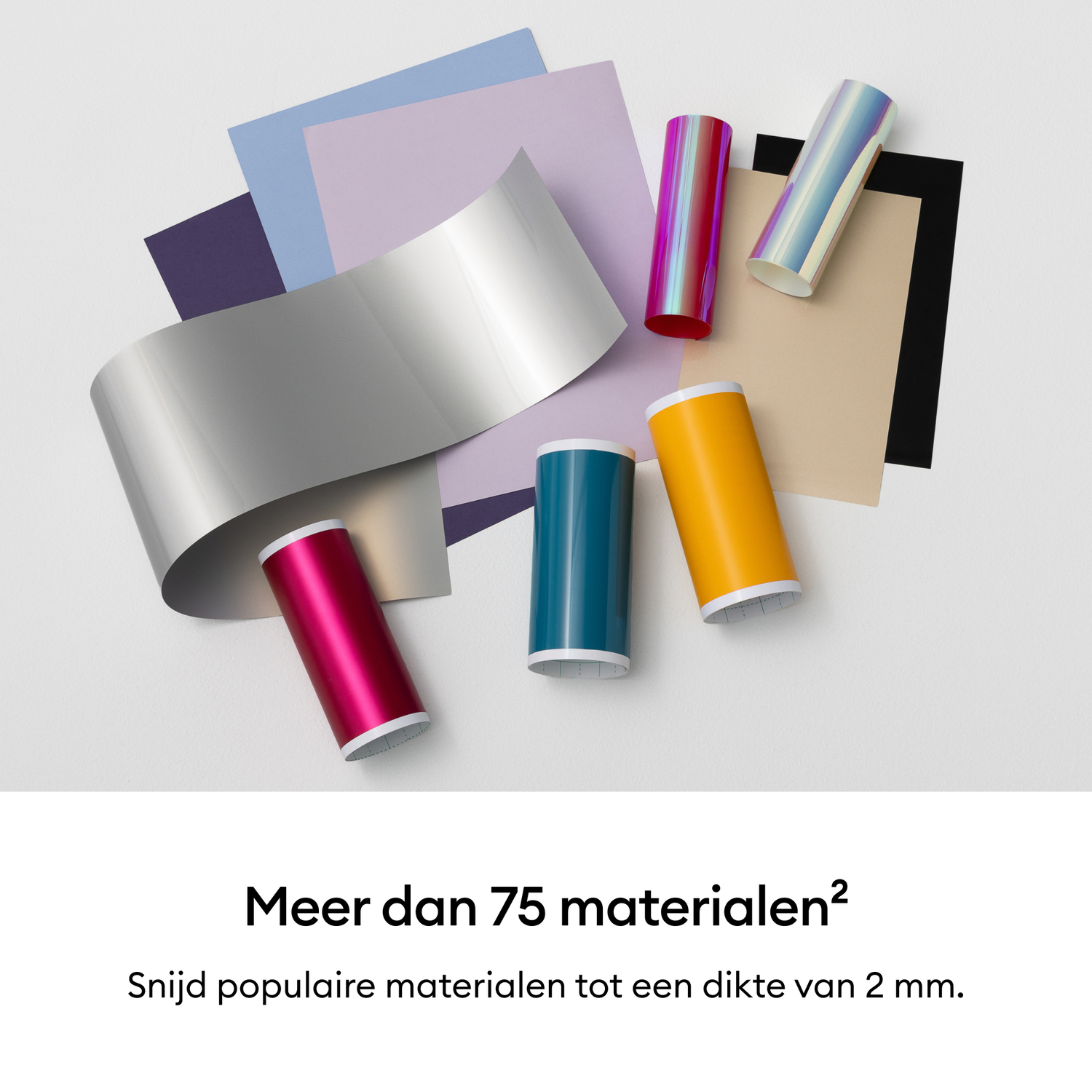 Various rolls of foil and paper sheets in different colors.