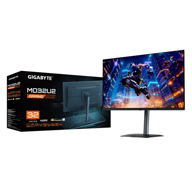 Caja y pantalla del monitor de juegos Gigabyte M32U con un paisaje urbano futurista.