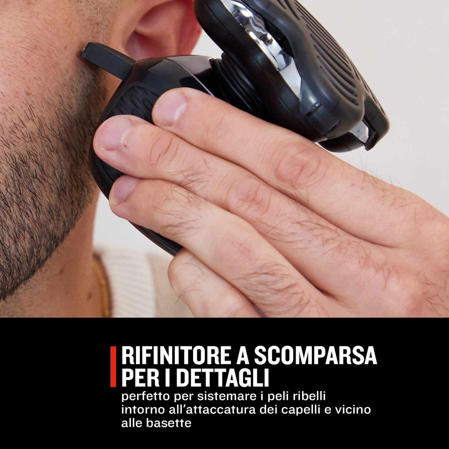 Una mano usa un rifinitore nero per definire le basette.