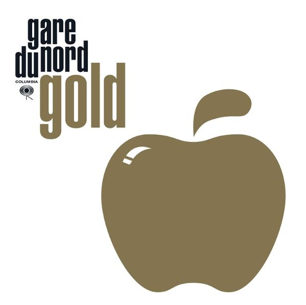 Goldener Apfel und Schriftzug 'gare du nord gold' auf weißem Hintergrund.