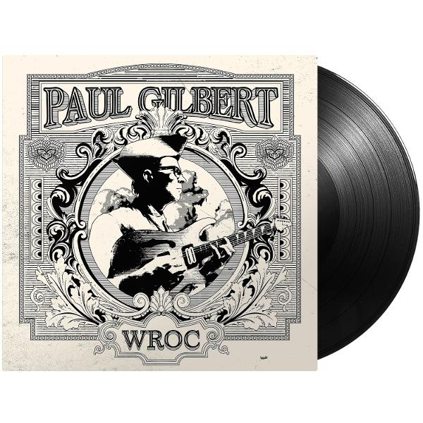Albumcover: Paul Gilbert spielt Gitarre, daneben eine Schallplatte.