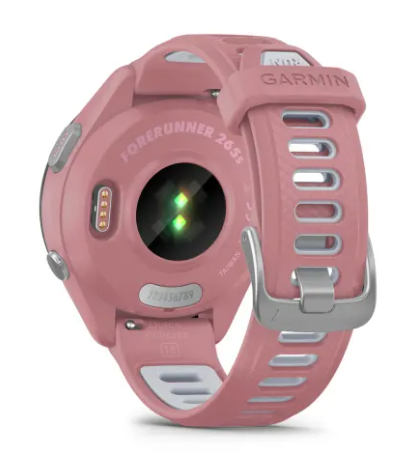 Różowy smartwatch Garmin Forerunner 265s z czujnikiem tętna i silikonowym paskiem.