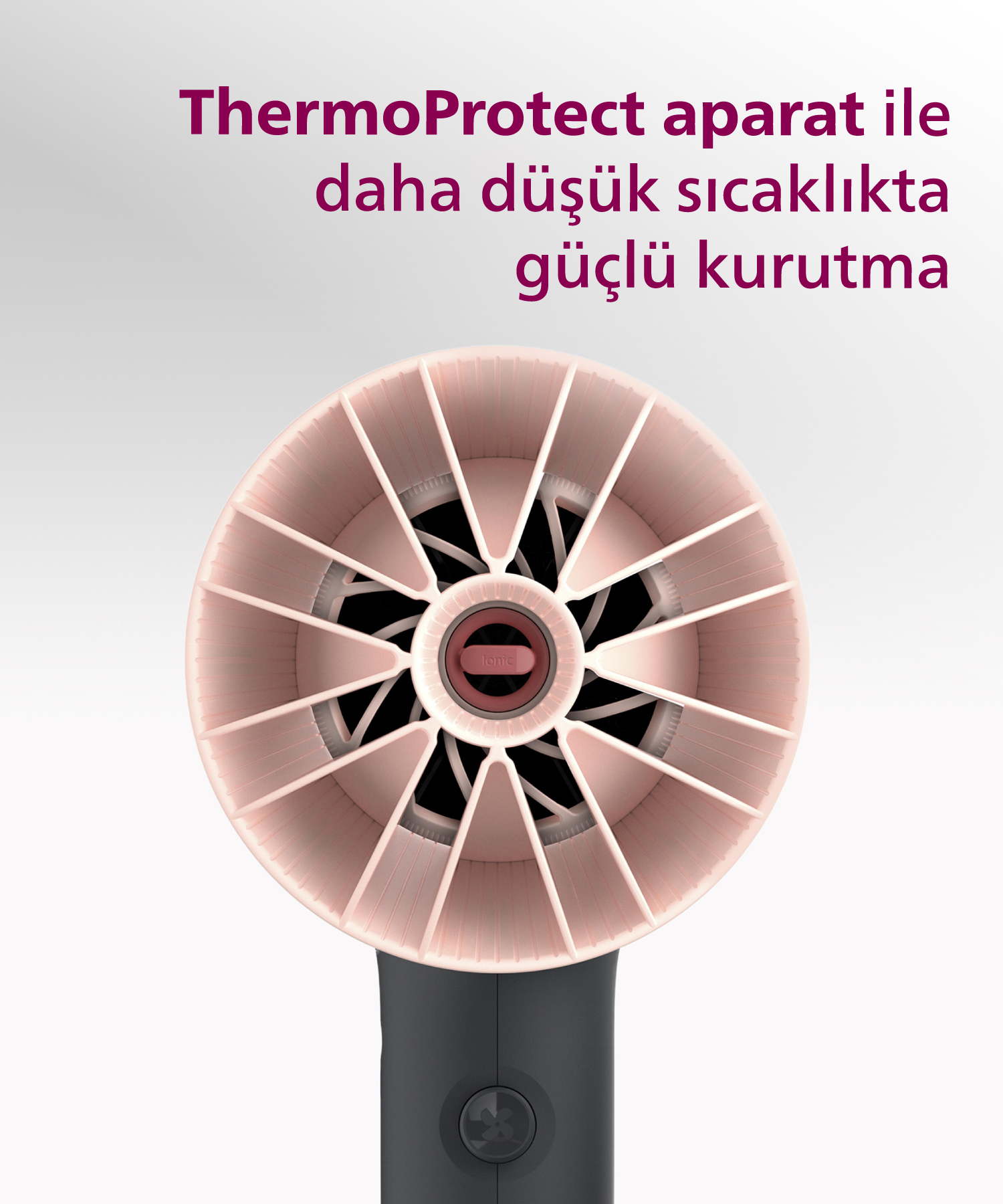 Turbo fanlı ve gümüş aksanlı pembe saç kurutma makinesi.
