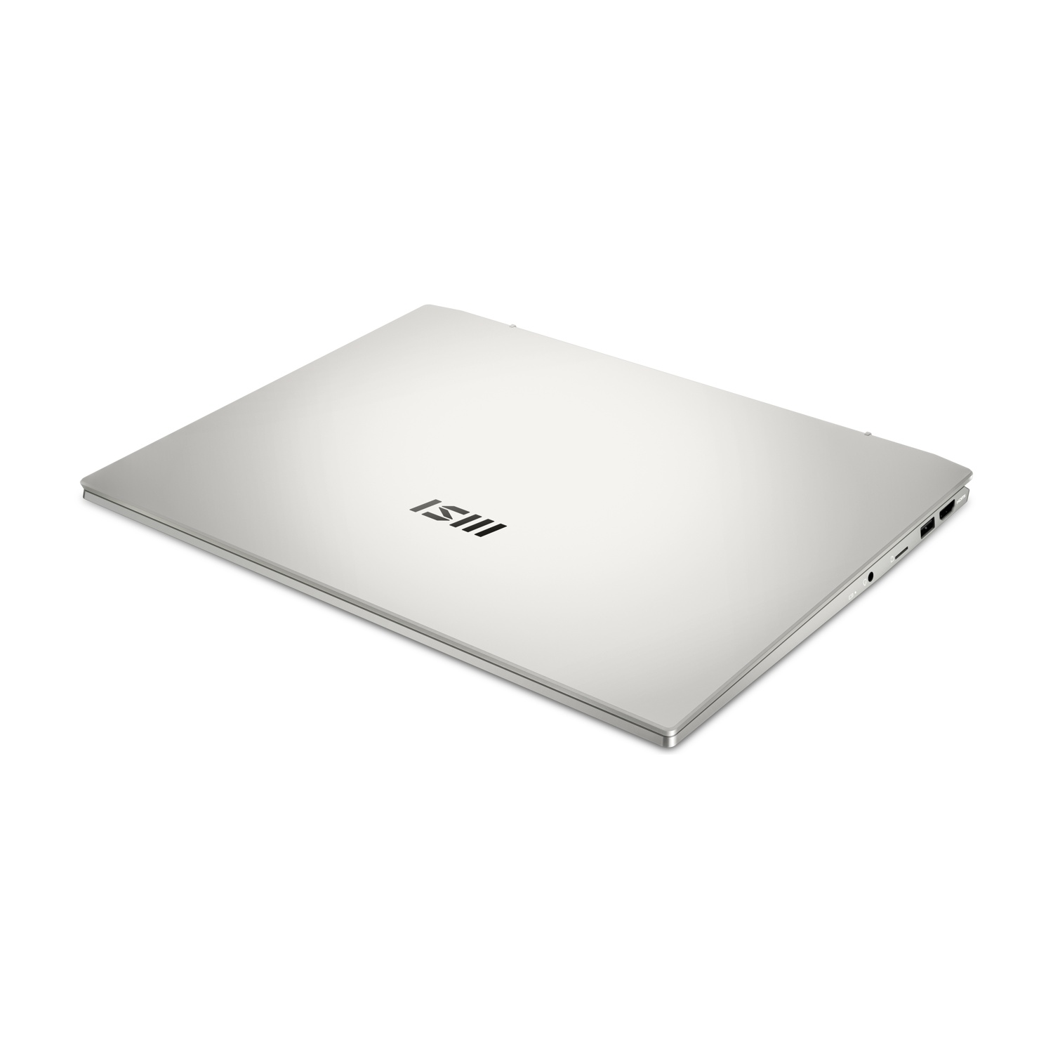 Un laptop argentato con il coperchio chiuso, logo MSI, visto di lato.