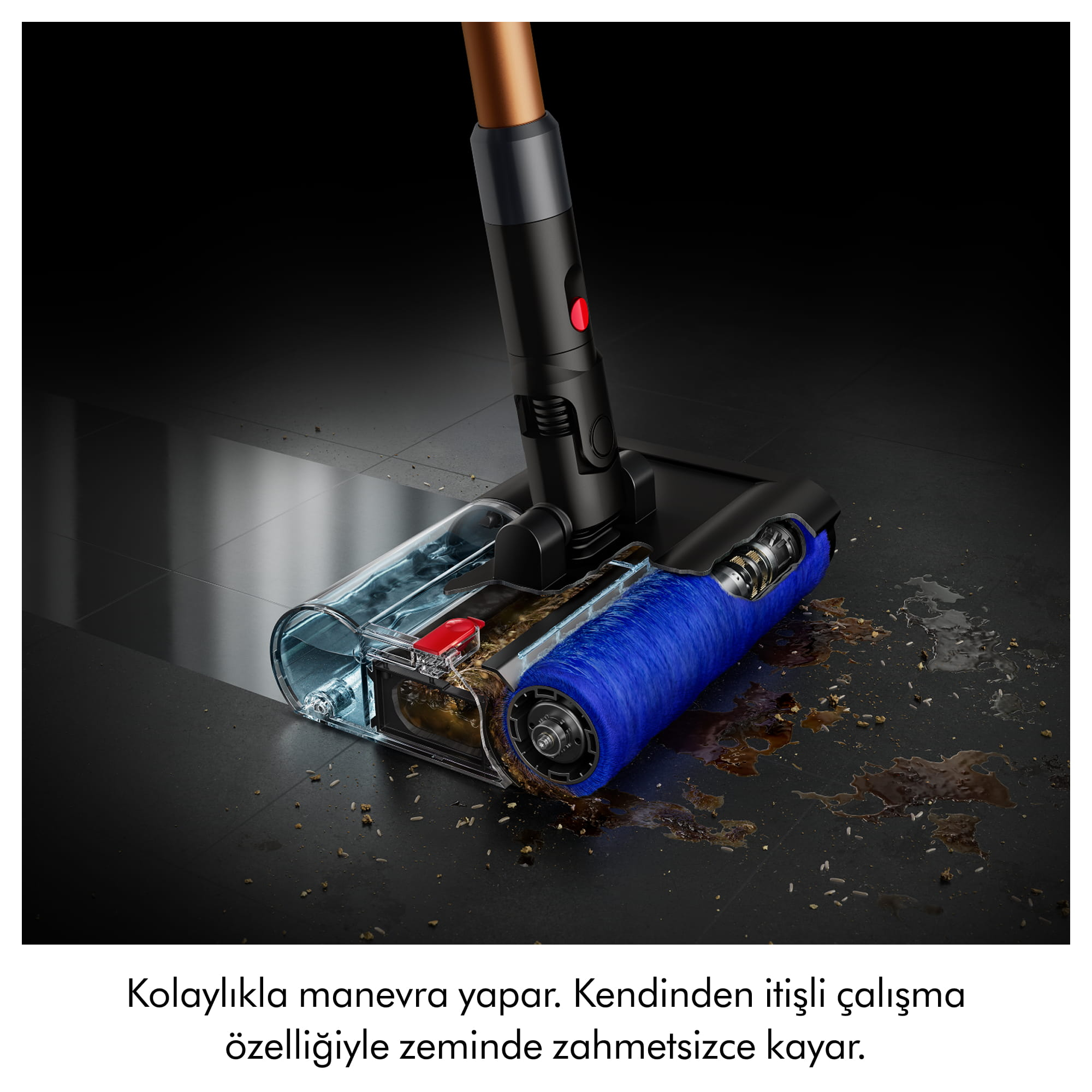 Mavi fırçalı bir elektrikli süpürge başlığı enkazı temizliyor.