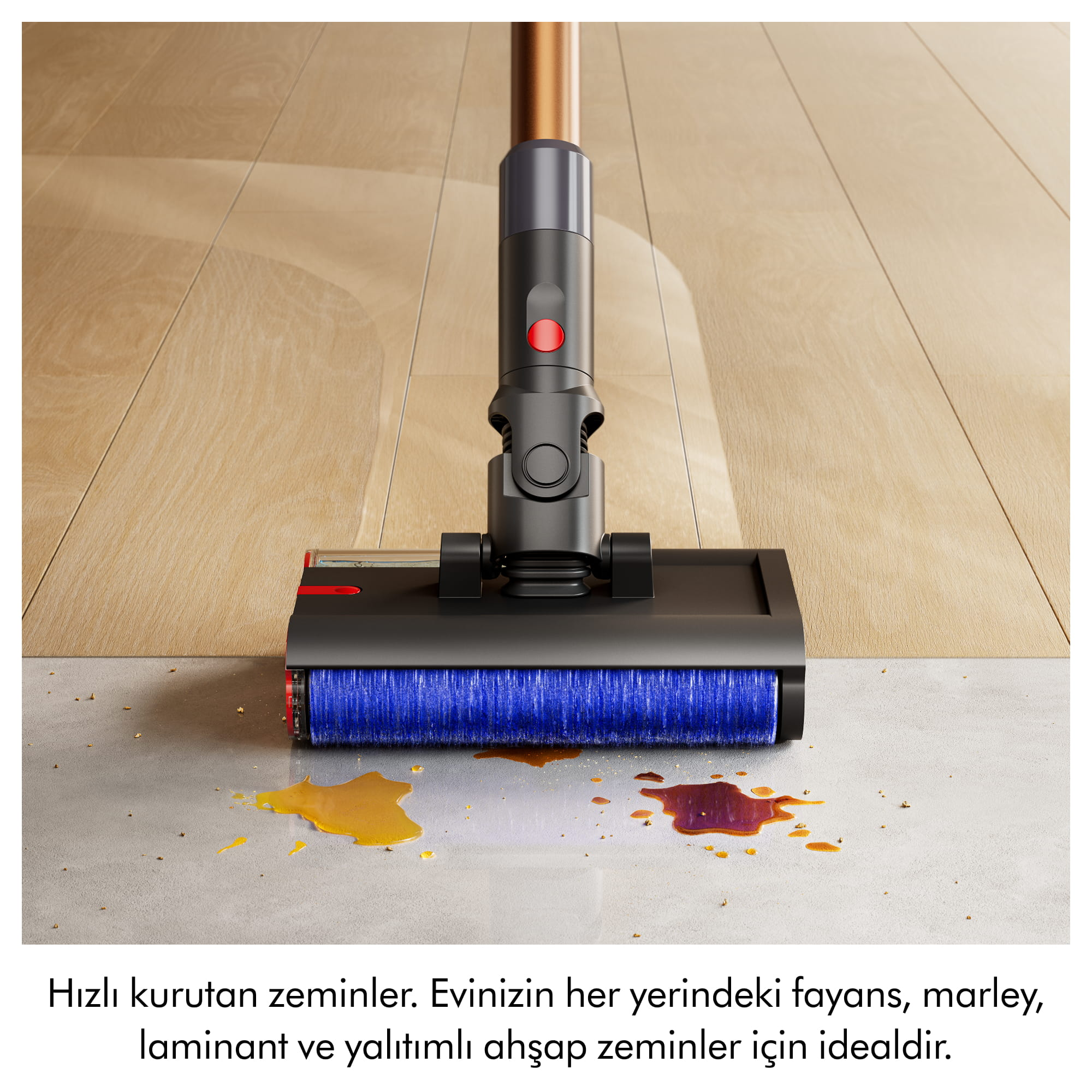 Vakumlu süpürge başlığı ahşap ve fayans zemindeki sıvı dökülmelerini temizliyor.
