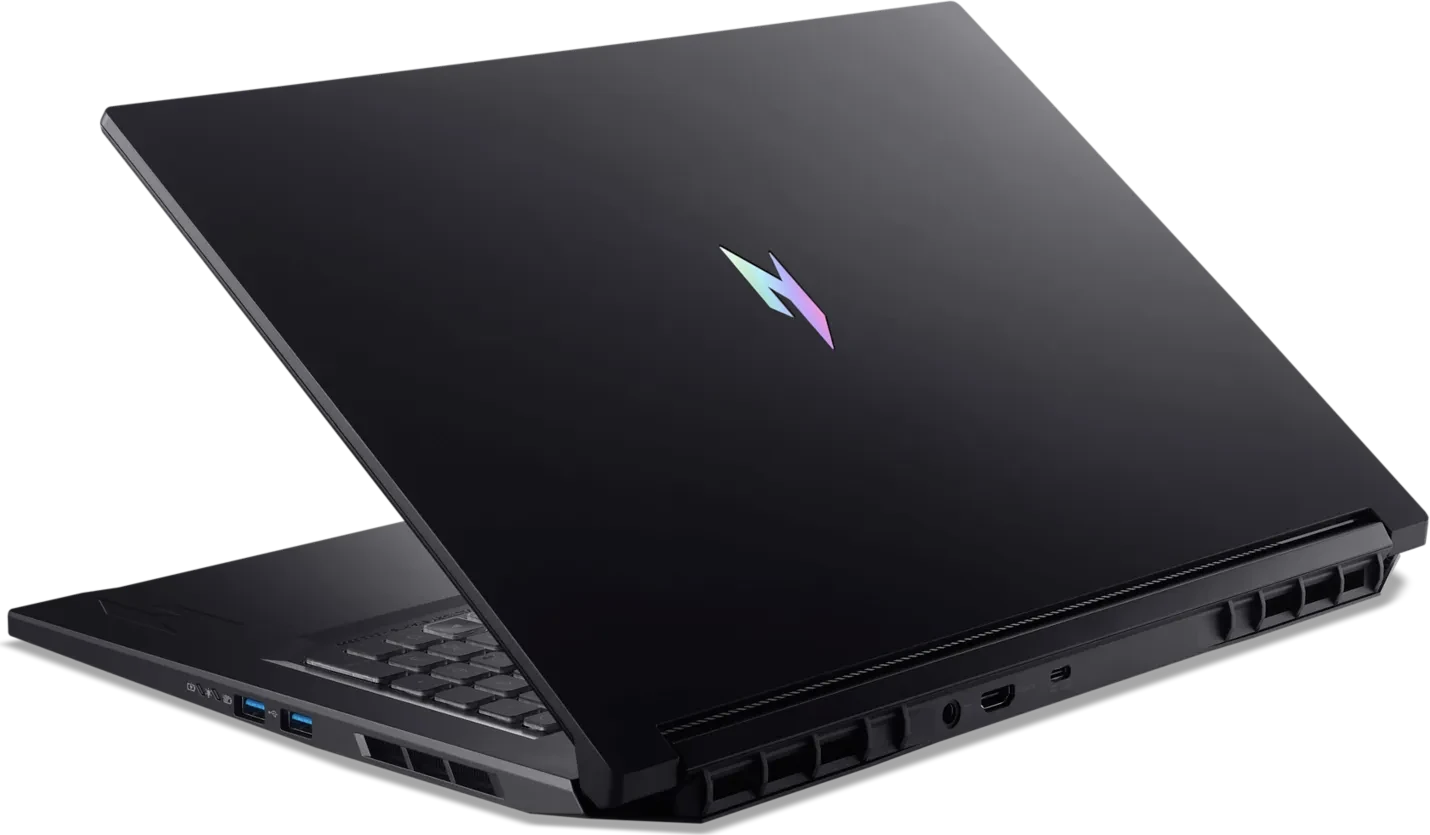 Fekete laptop világító logóval, oldalról nyitva látható.