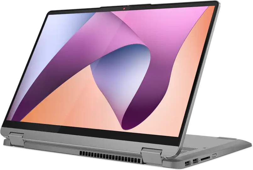 Ezüst laptop nyitott képernyővel, színes absztrakt háttérrel.