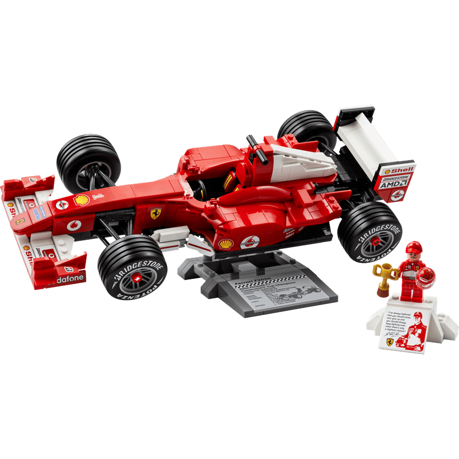 Voiture F1 Ferrari LEGO rouge, un pilote, un trophée et un présentoir sur fond noir.