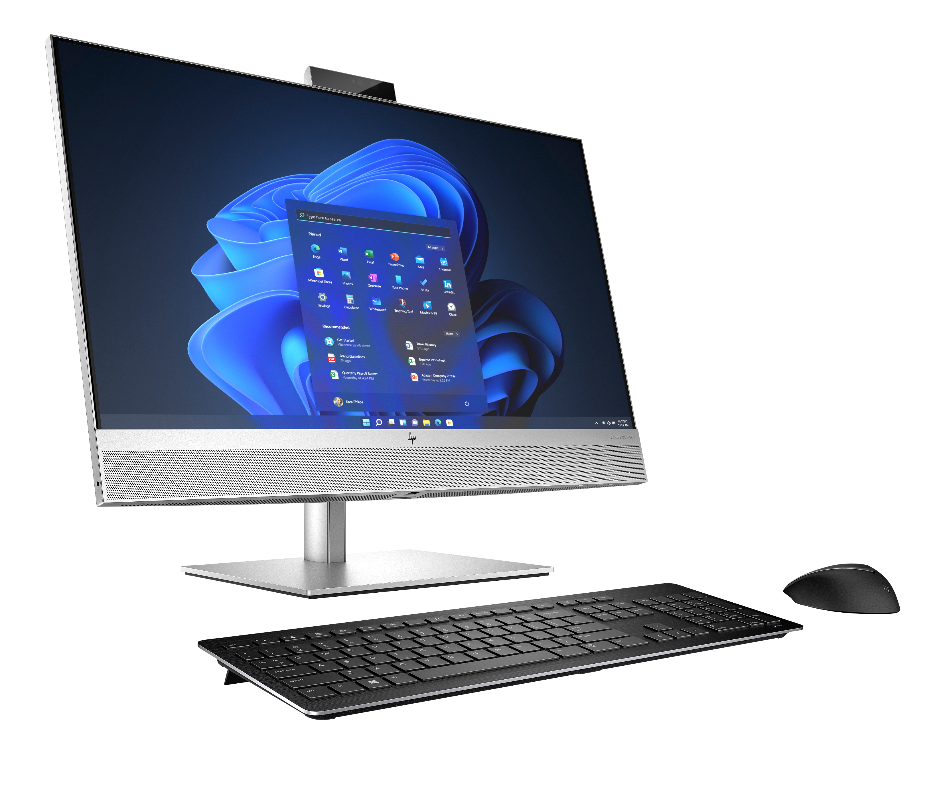 Ein silberner All-in-One-PC mit Tastatur und Maus auf schwarzem Hintergrund.