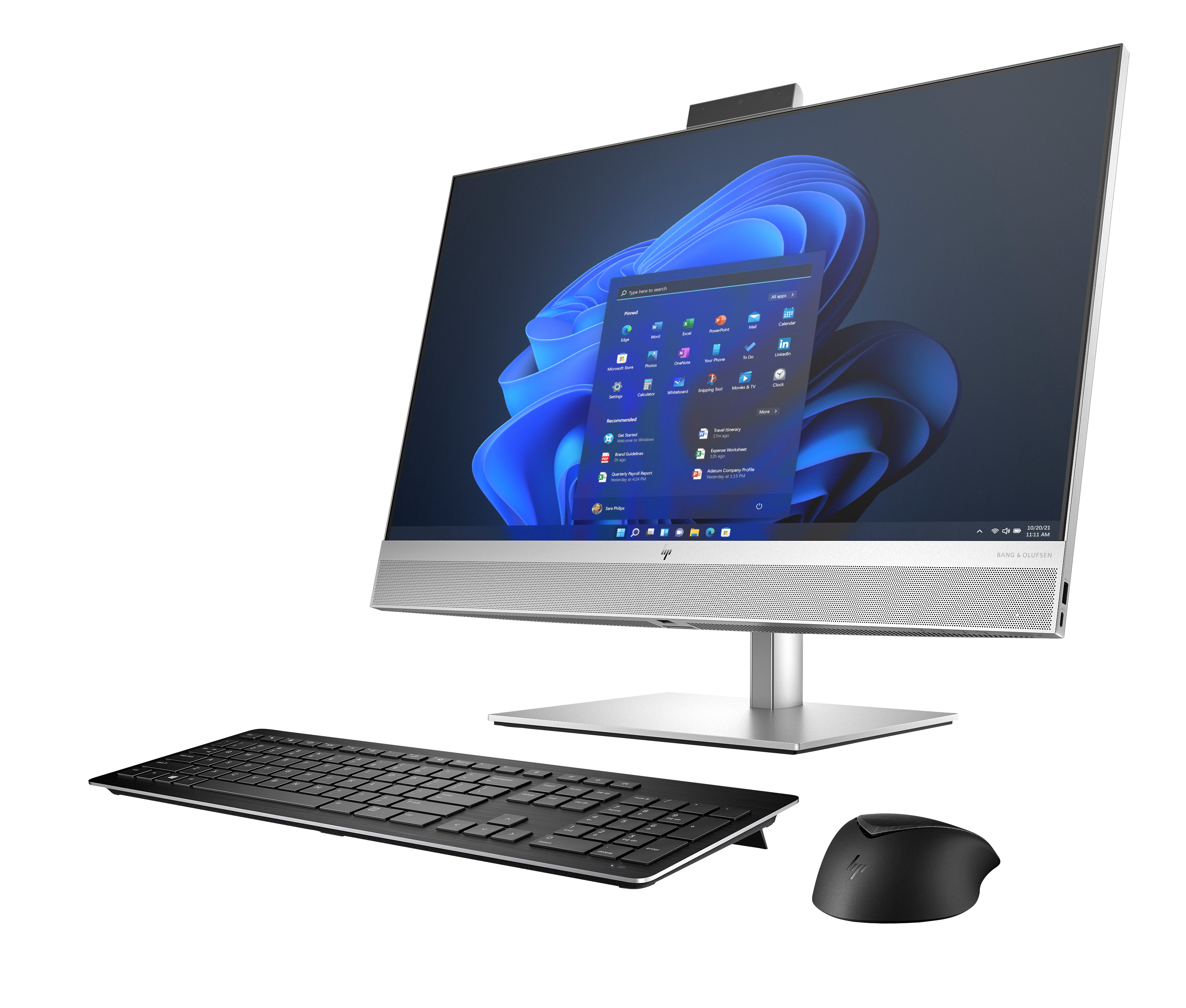 Ein silberner All-in-One-Computer mit Tastatur und Maus auf schwarzem Hintergrund.