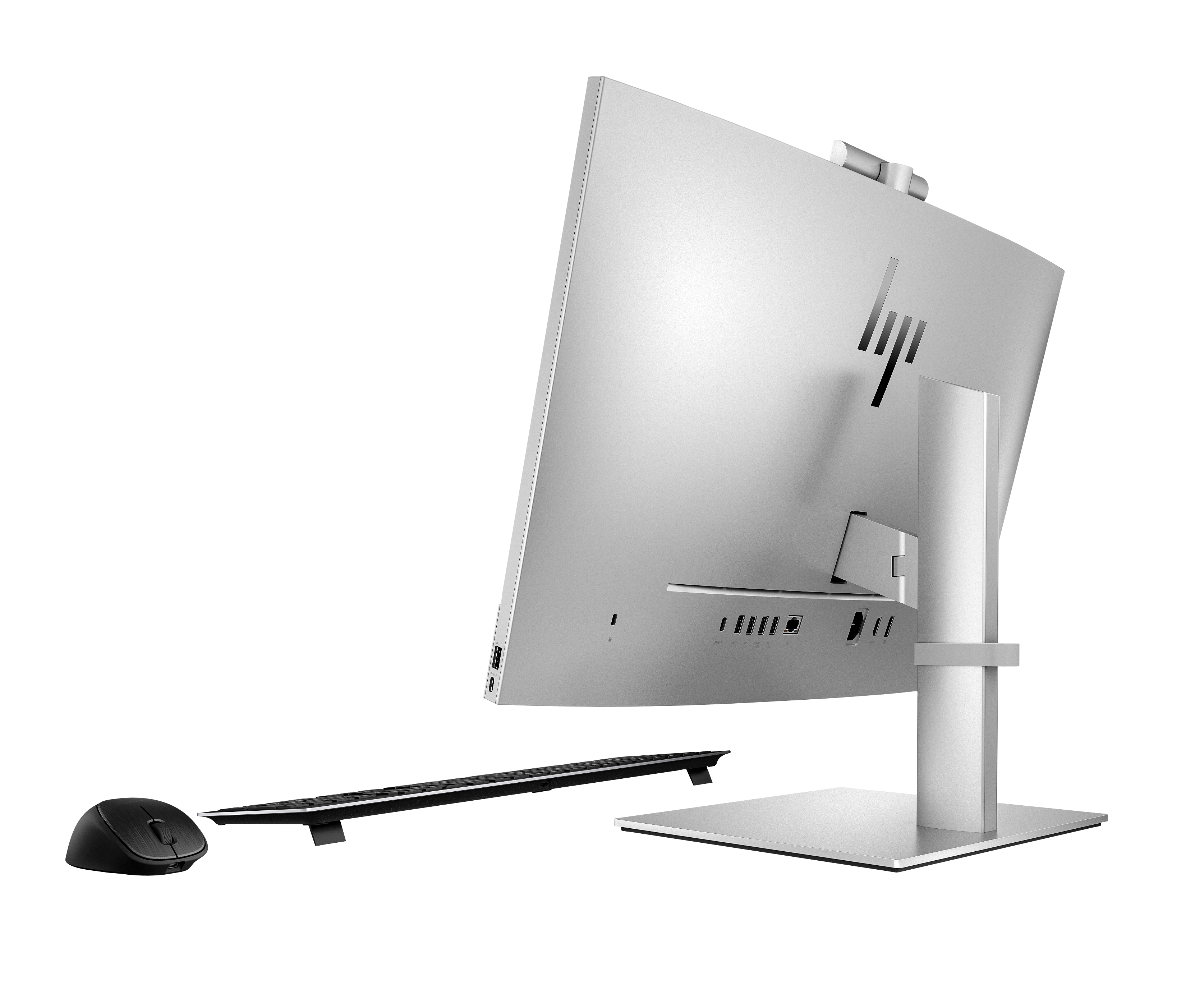 Silberner HP All-in-One-PC mit Tastatur und Maus im Profil vor schwarzem Hintergrund.