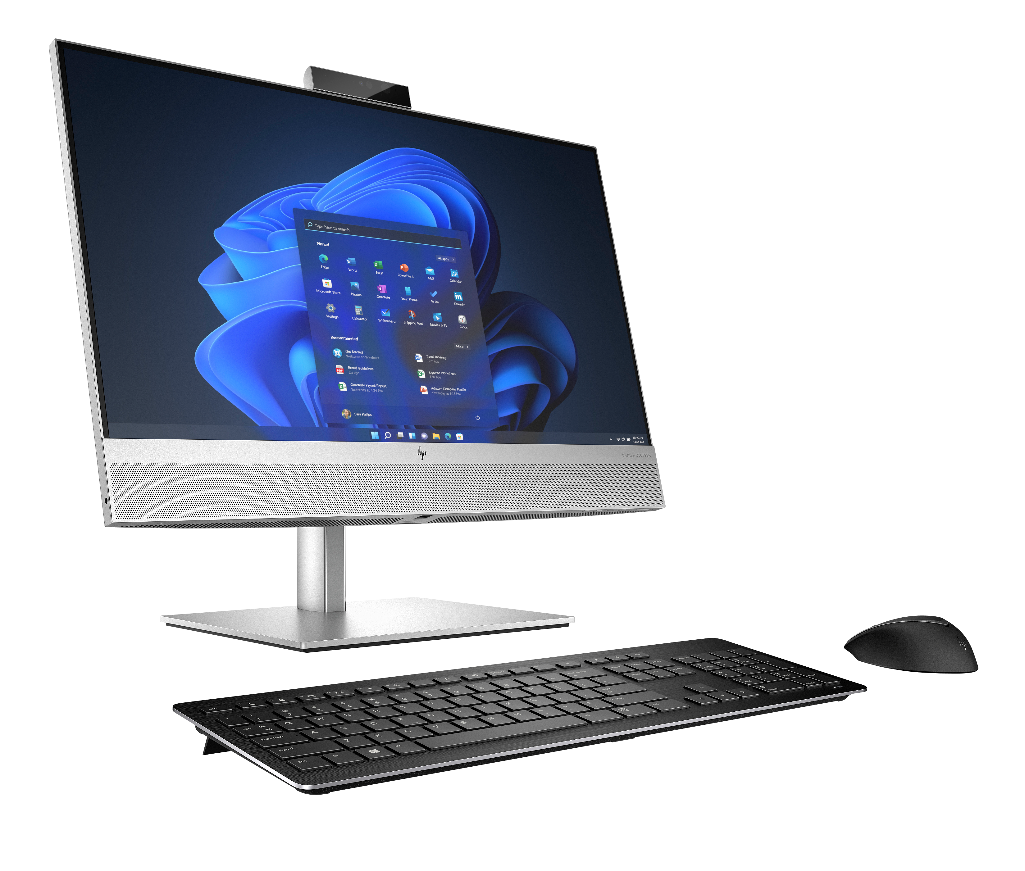 Ein silberner All-in-One-PC mit Tastatur und Maus auf schwarzem Hintergrund.