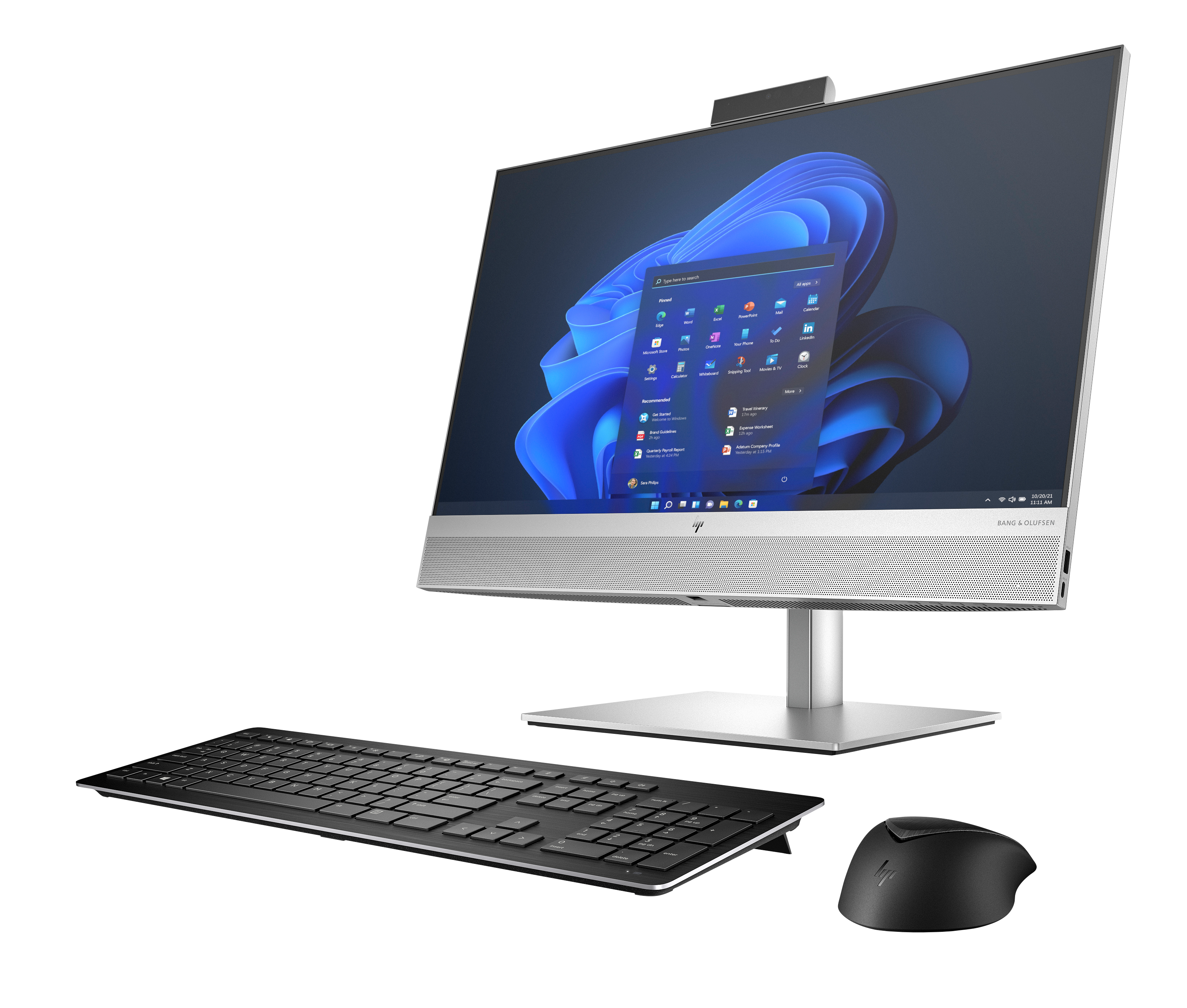 Ein silberner All-in-One-Computer mit Tastatur und Maus vor schwarzem Hintergrund.