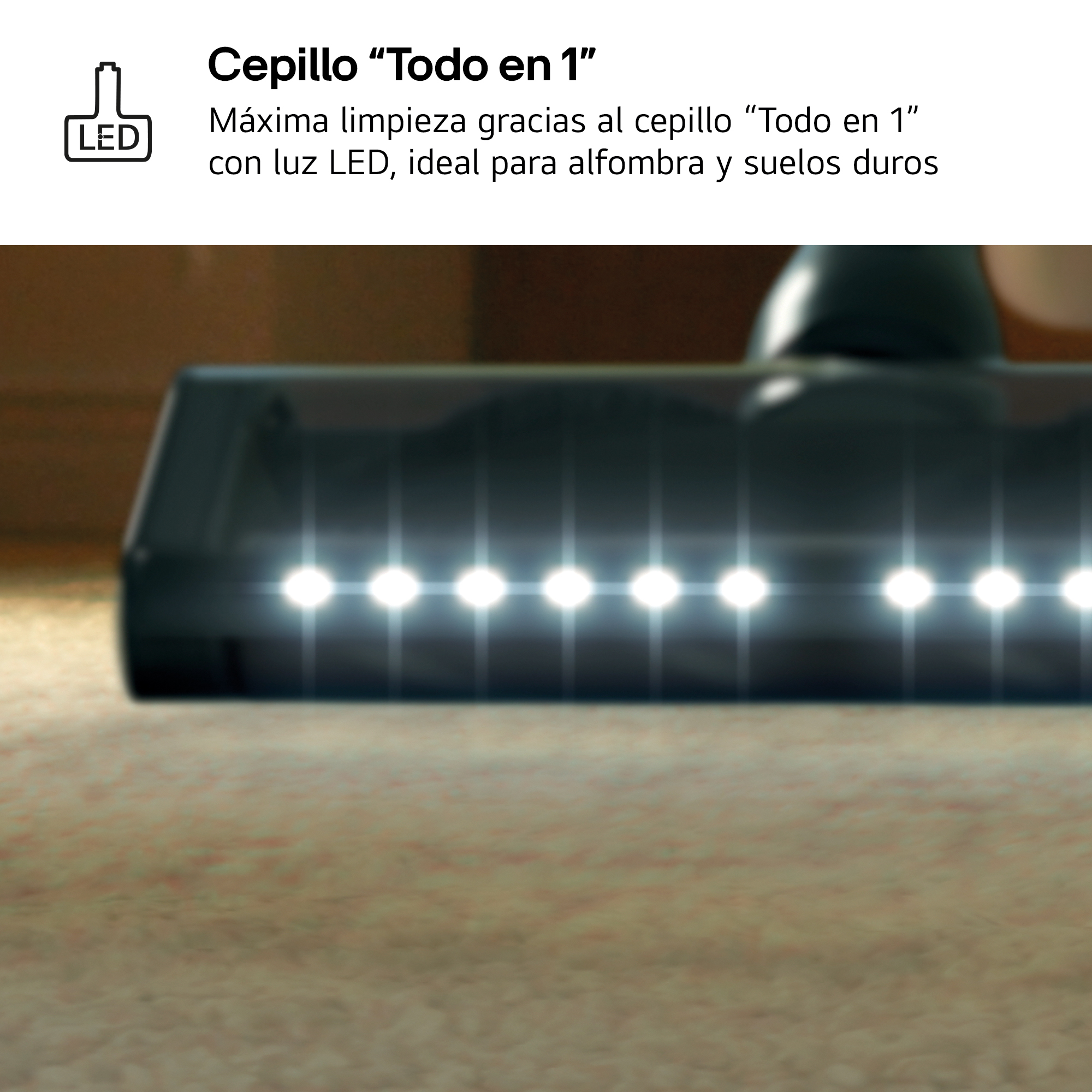 Un cabezal de aspiradora con luces LED sobre una alfombra.