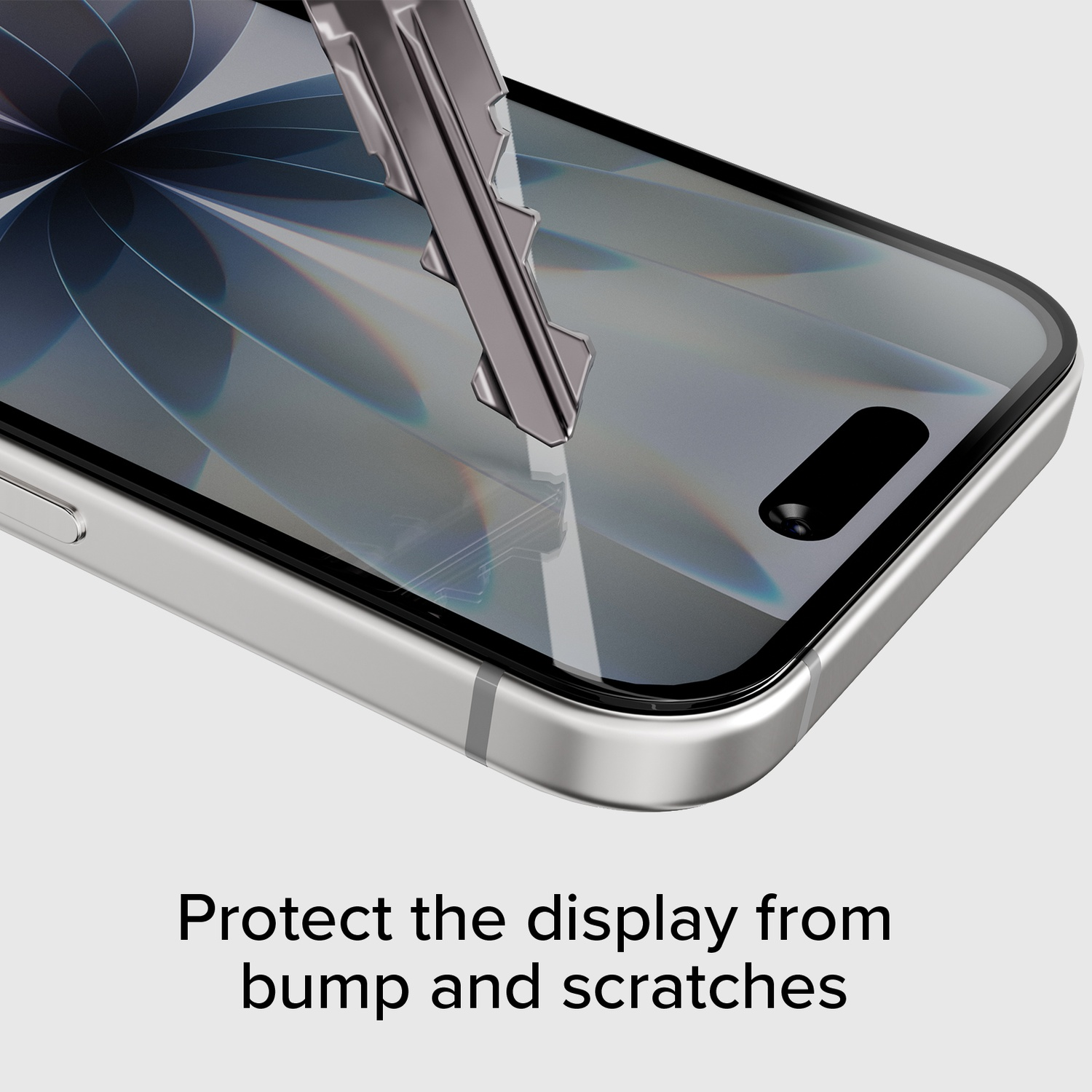 Une clé égratigne l'écran d'un smartphone pour montrer la protection.