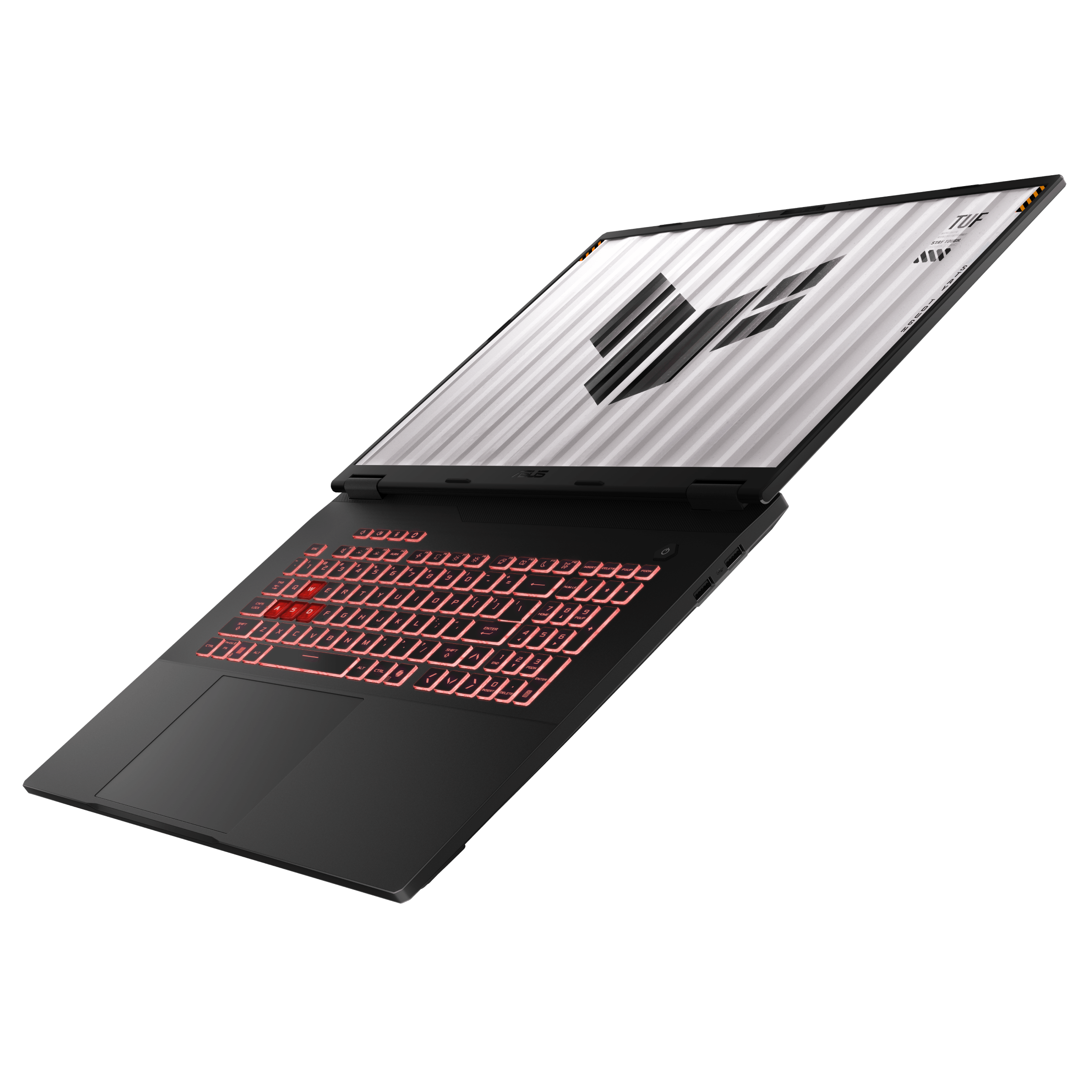 Otwarty laptop z podświetlaną na czerwono klawiaturą i logo TUF na ekranie.